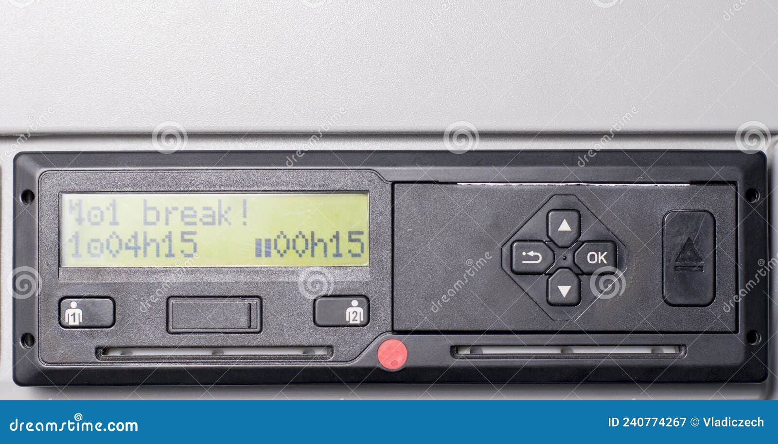 close up of tachograph with 15 minutes of driving left warning on display. driver is due to take 45 minutes break.