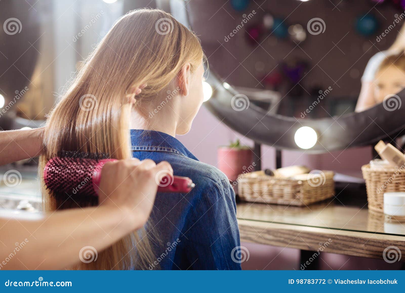 Close Up Of Teenage Girl Having Her Hair Brushed Stock Photo