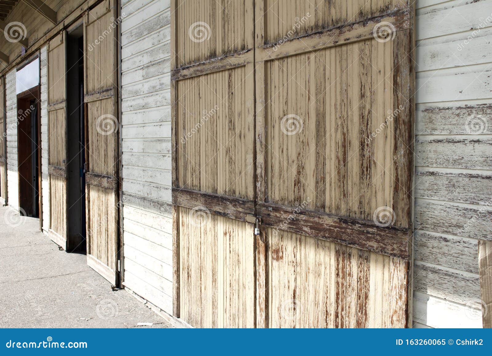 Close Up Texture View of Rustic Brown Wooden Doors on a Railroad