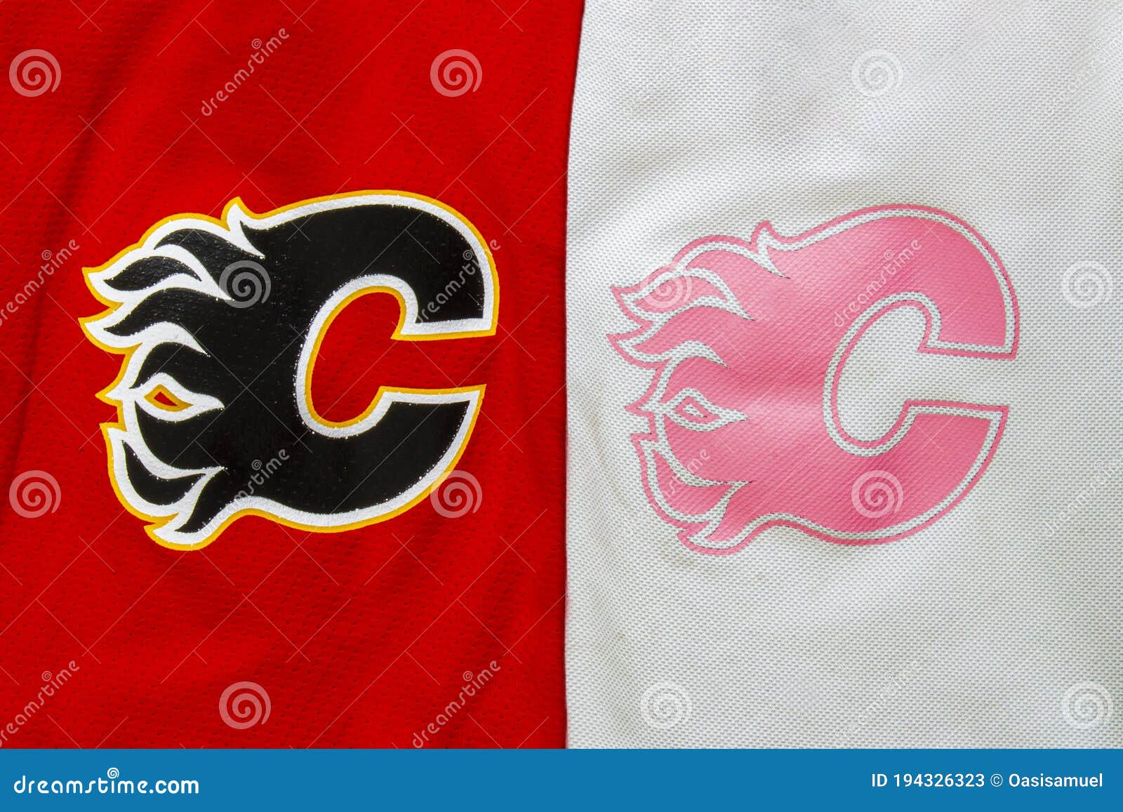 A Close Up To a NHL Calgary Flames Logo on a Red and Pink Hockey