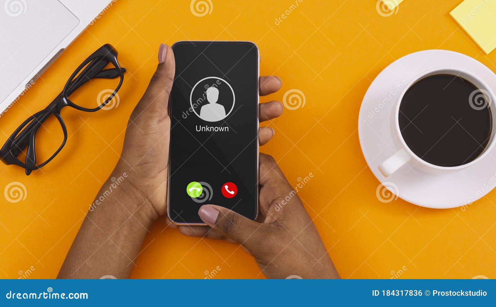 female hand holding phone with incoming call from unknown