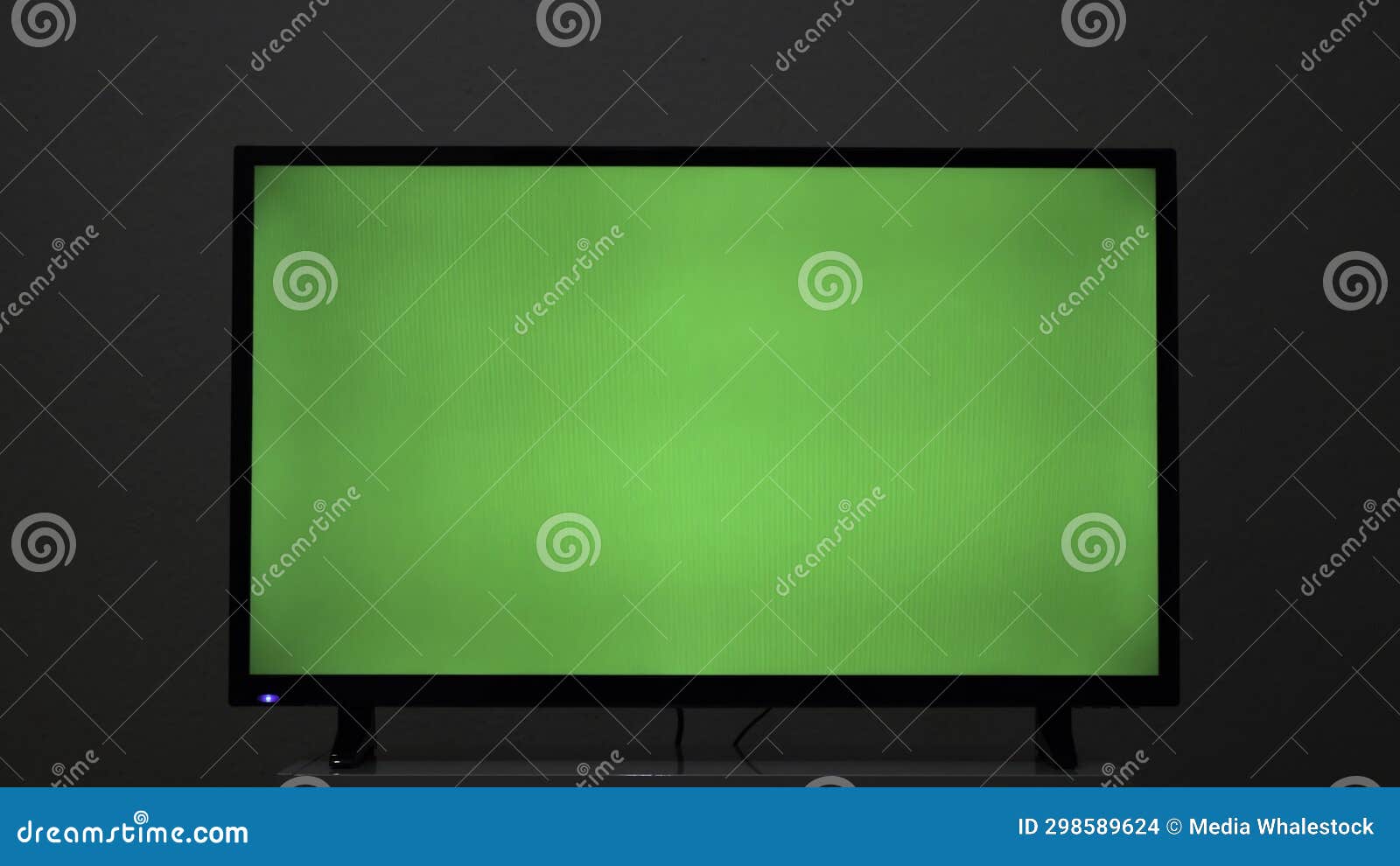 Closeup of TV Screen with Green Background. Concept. Plasma TV Screen