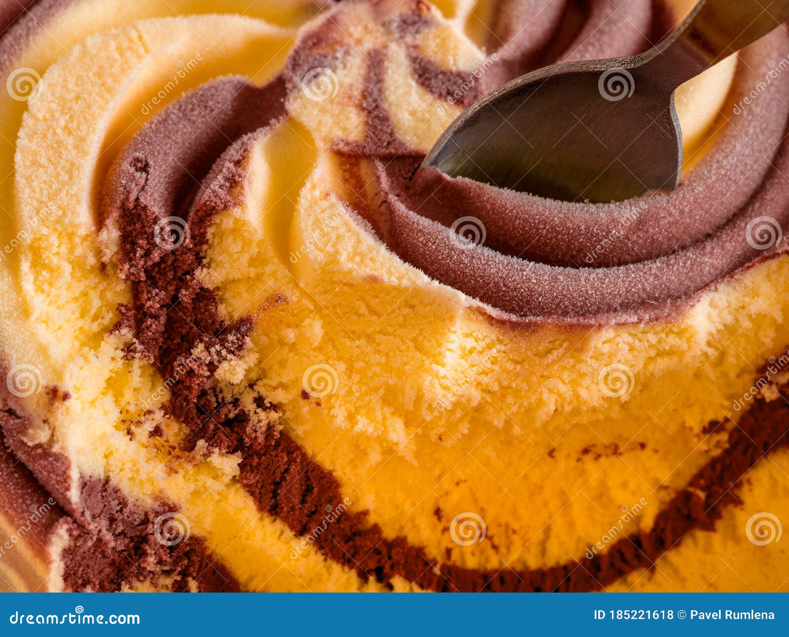 Closeup of Twisted Vanillachocolate Ice Cream with a Spoon Stock