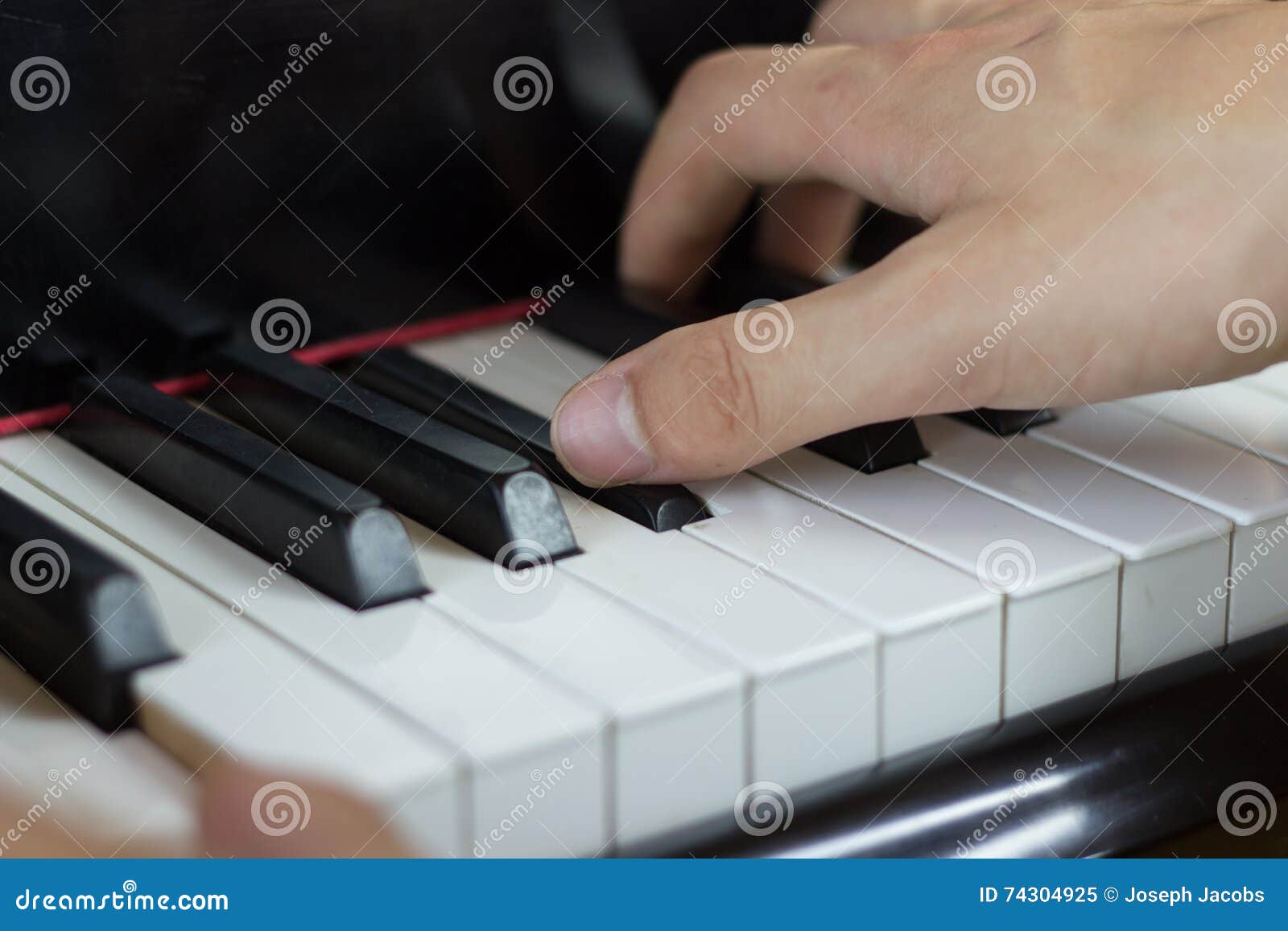 Close Up of Two Hands Playing Piano Stock Image - Image of black, field