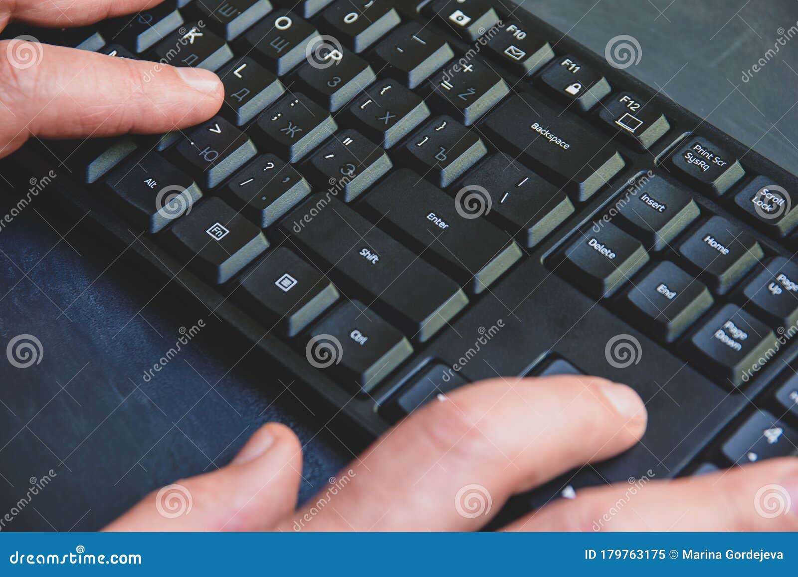 Close-up of Typing Man`s Hands on Black Keyboard. Hand Writing