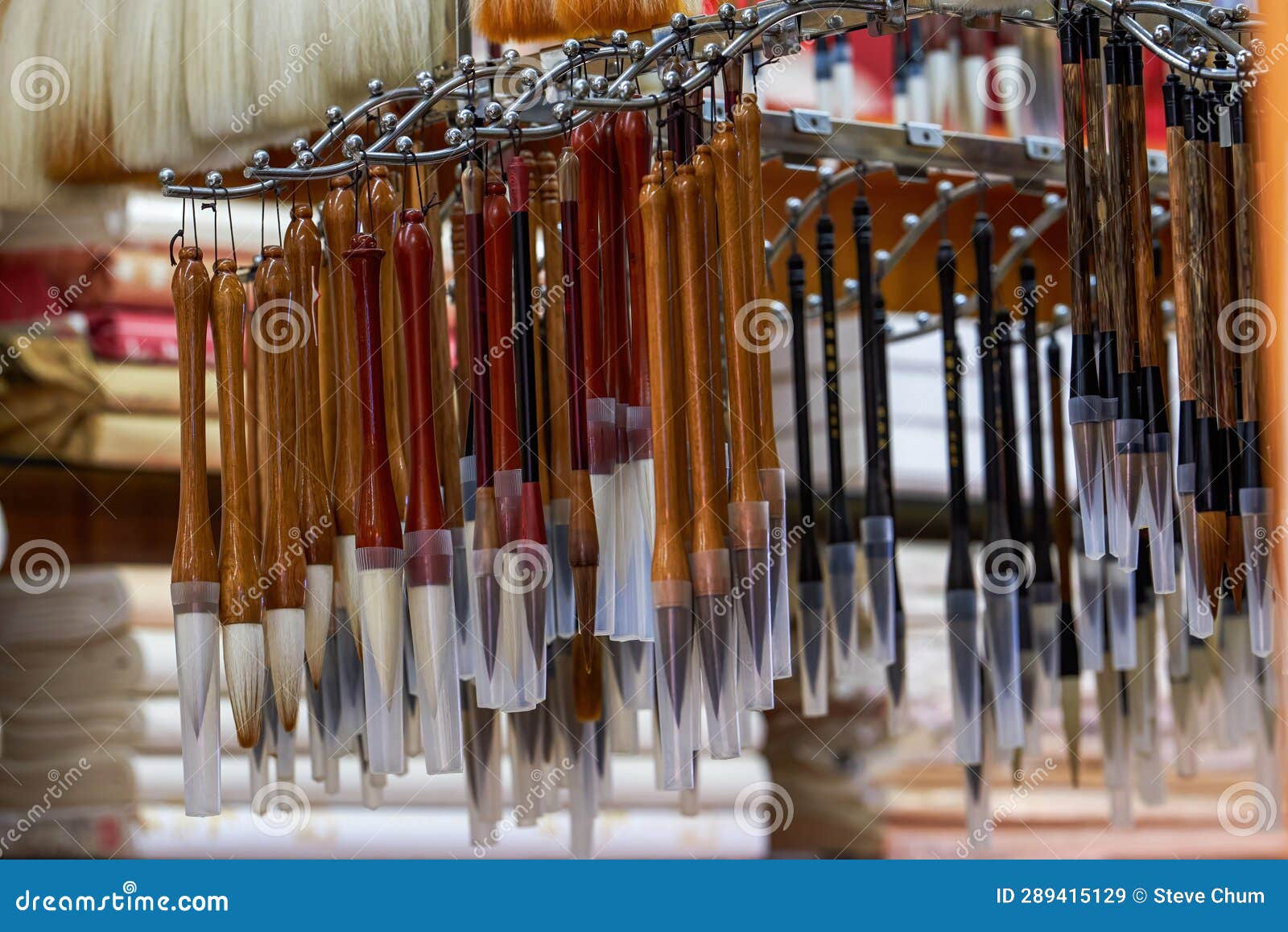 close-up of various traditional chinese brushes sold in the market