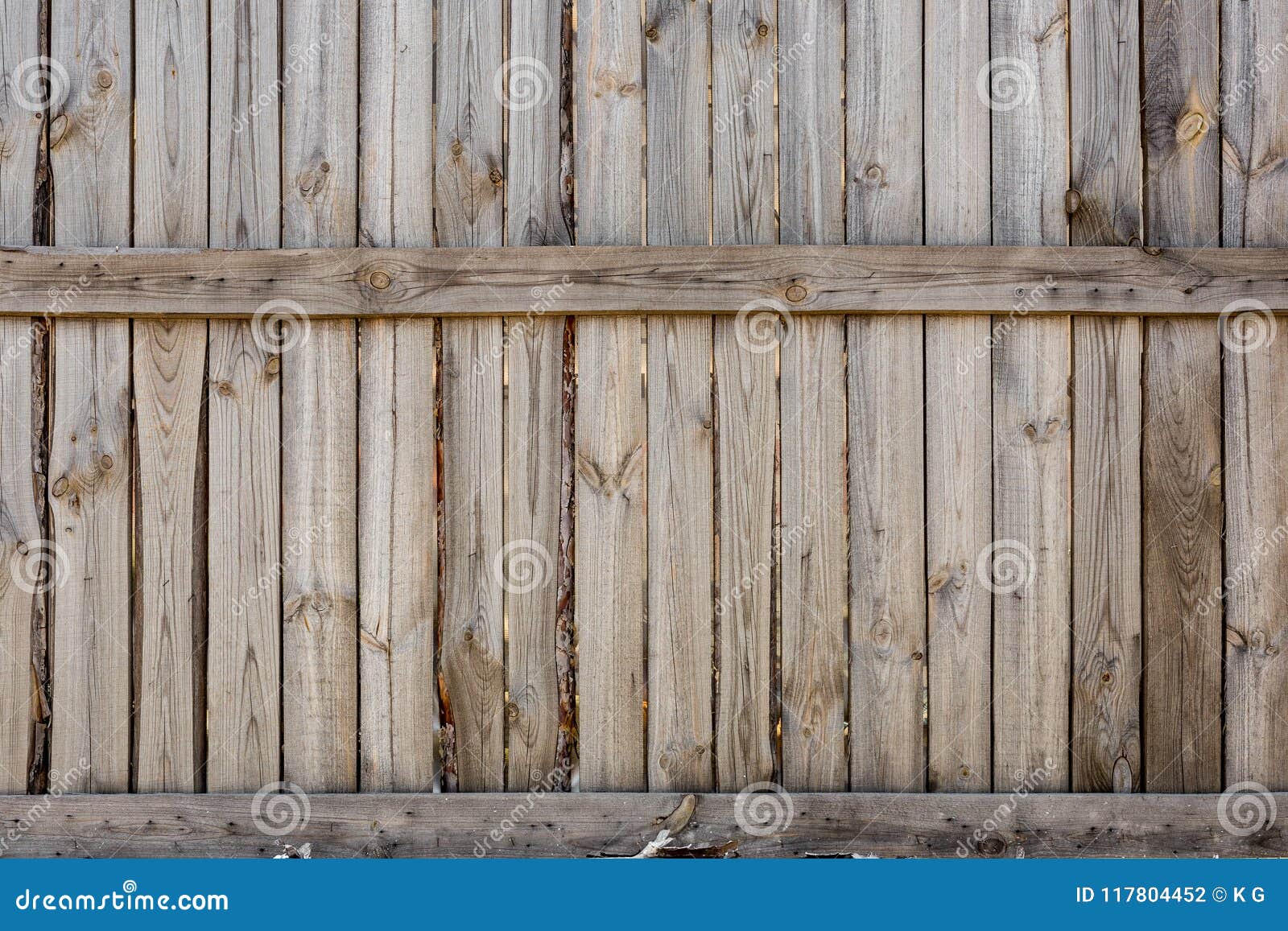 close-up of vertical simple oak wooden fence background. old knotted timber wall. vintage rustic pattern. copyspace
