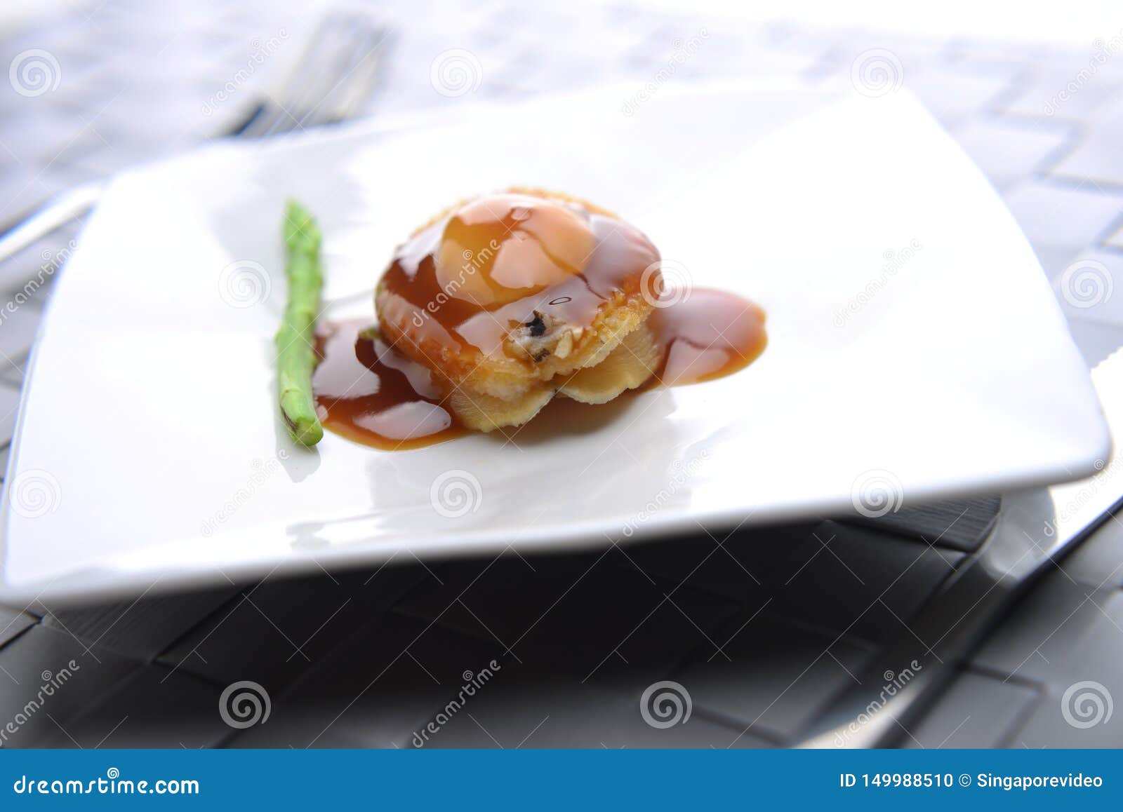 Closeup View of Abalone Being Served in a Restaurant Stock Photo