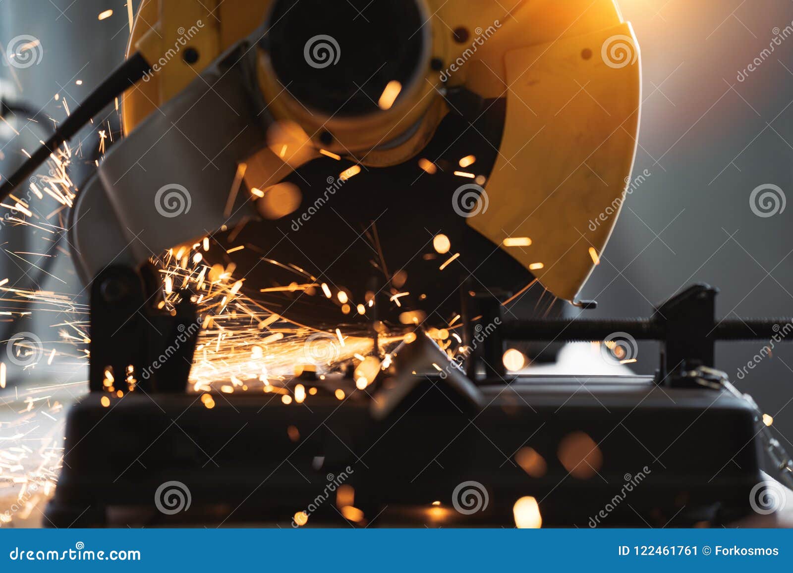 close-up view of angular grinding machine in action, sparks fly apart. work in process