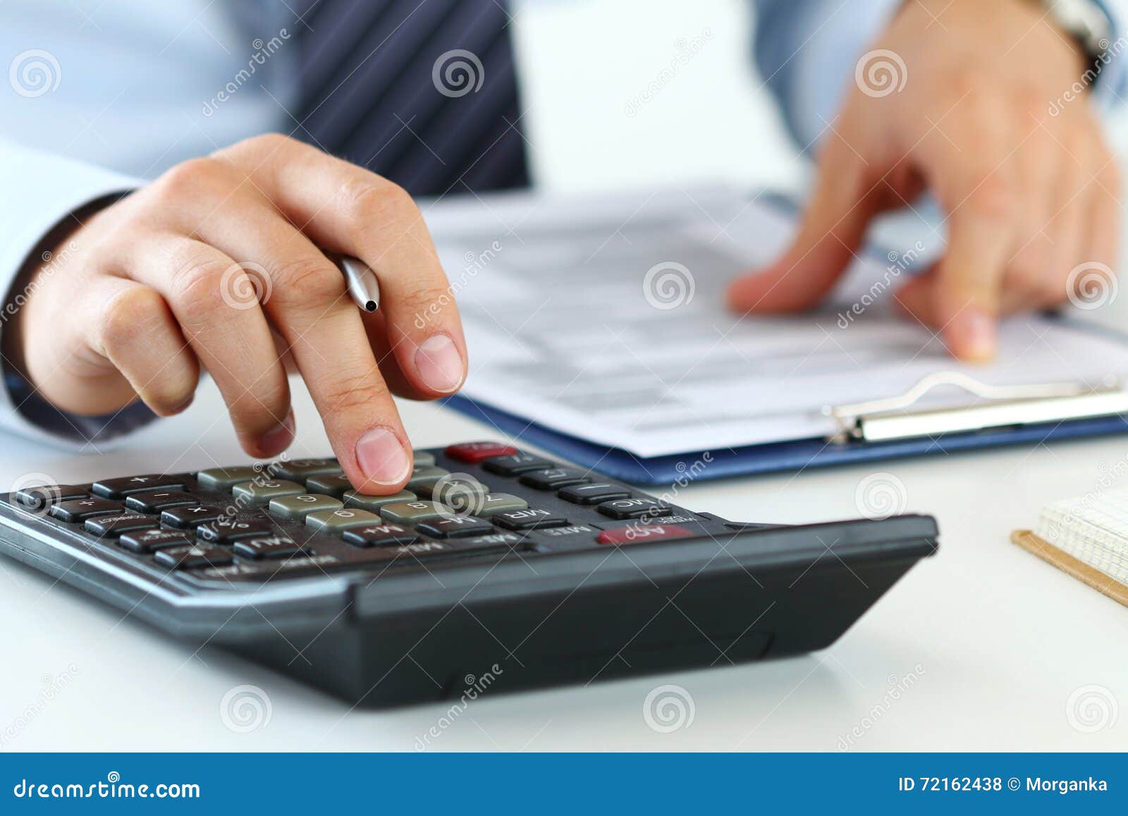close up view of bookkeeper or financial inspector hands making
