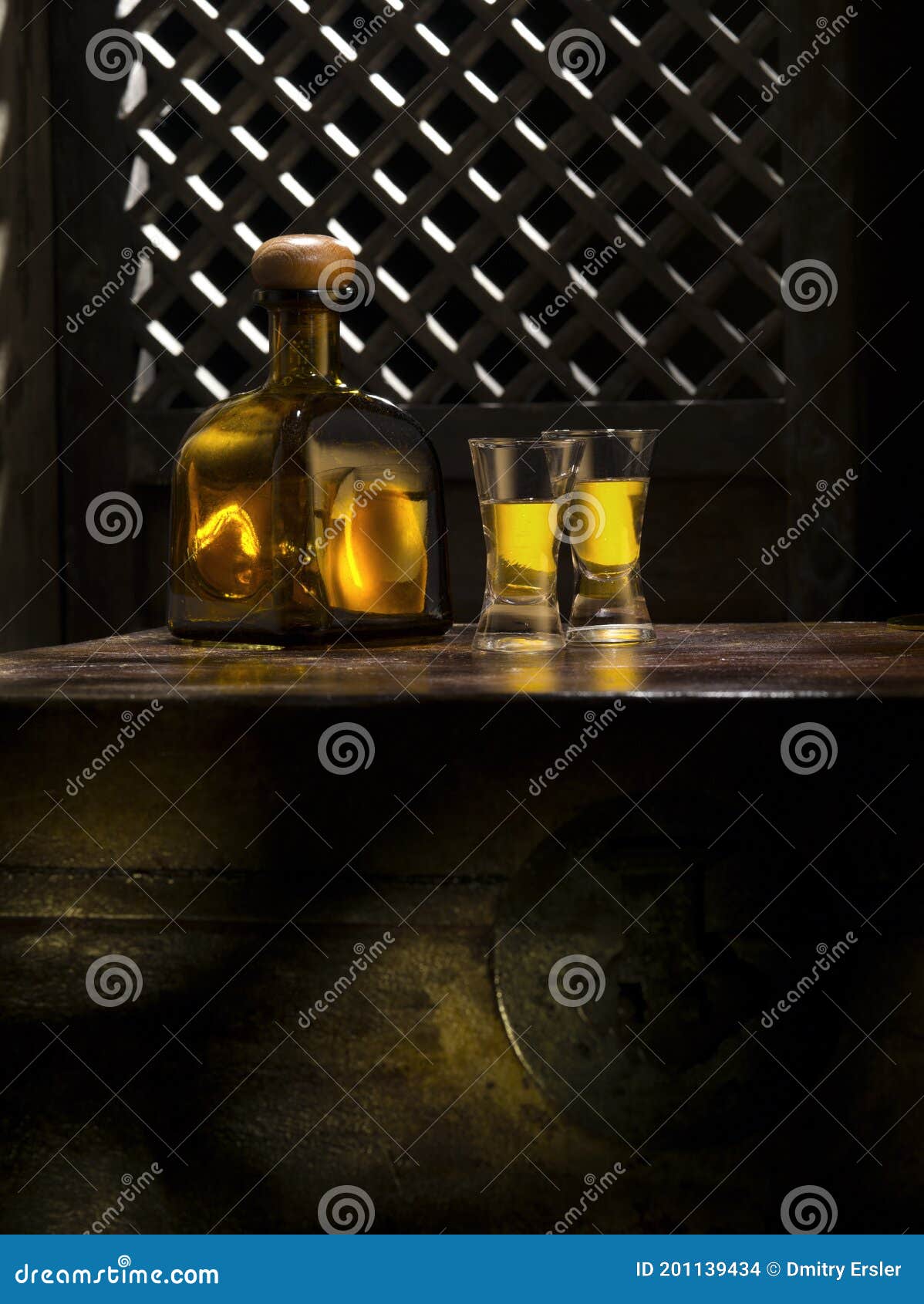 anejo and glasses on color background