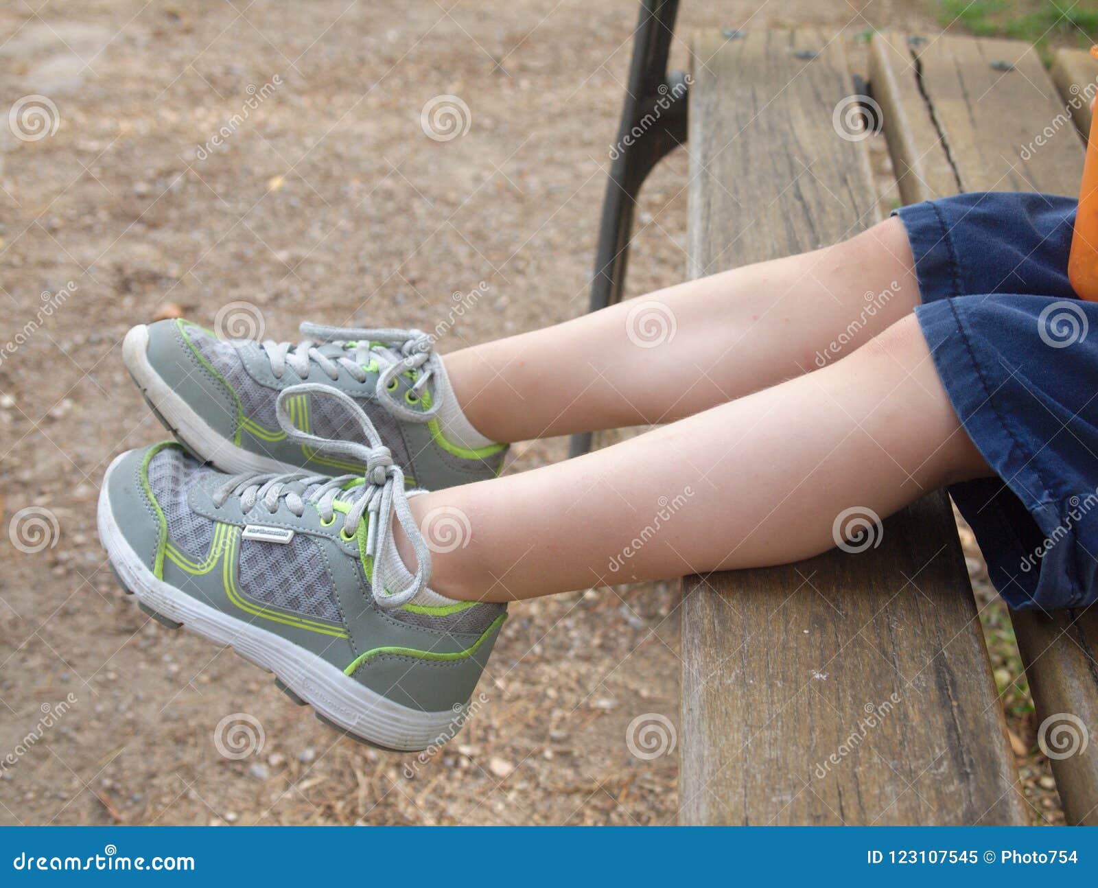 Close Up View of Boy Sitting on a Bench Stock Image - Image of grass ...