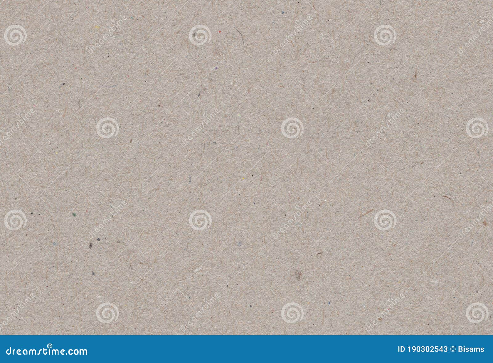 close up view of brownish grey paper carton background with inclusions of recycled paper particles.