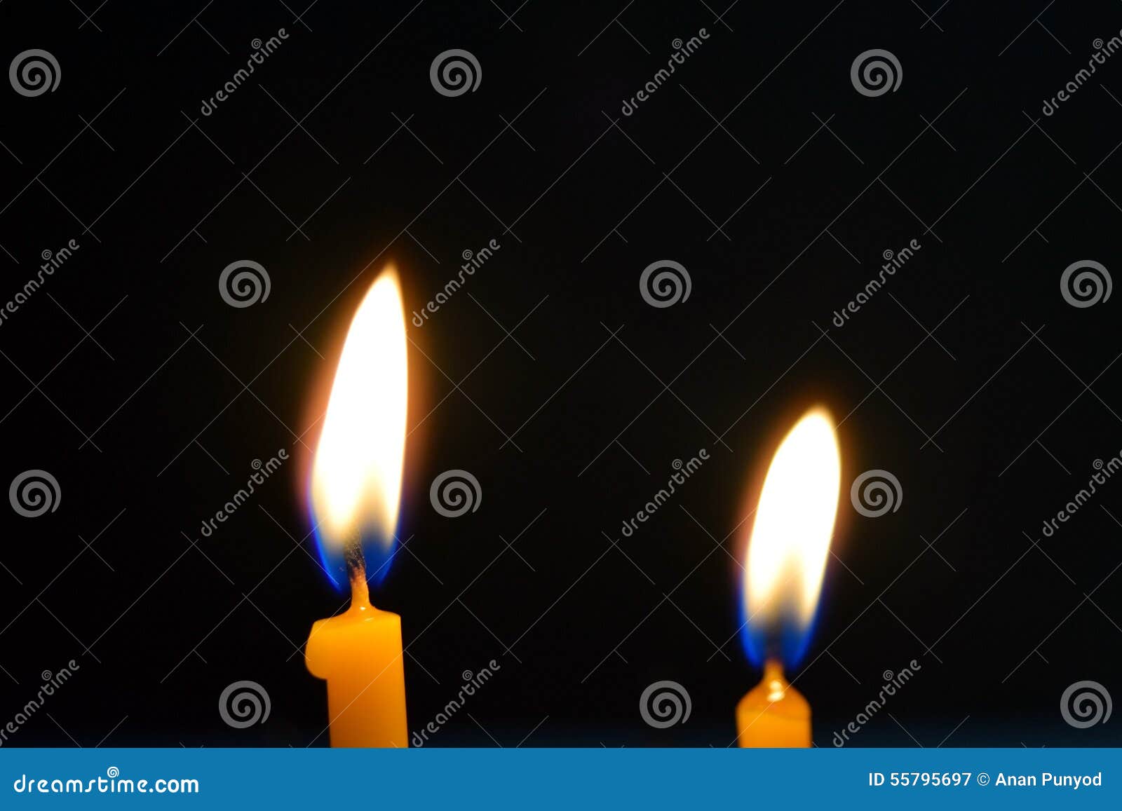 Close Up View of the Candles Burning Brightly in the Dark. Stock Image