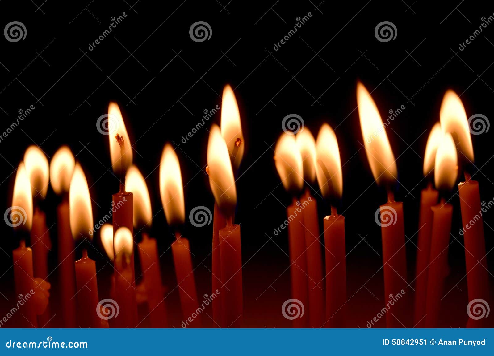 Close Up View of the Candles Burning Brightly in the Dark. Stock Image