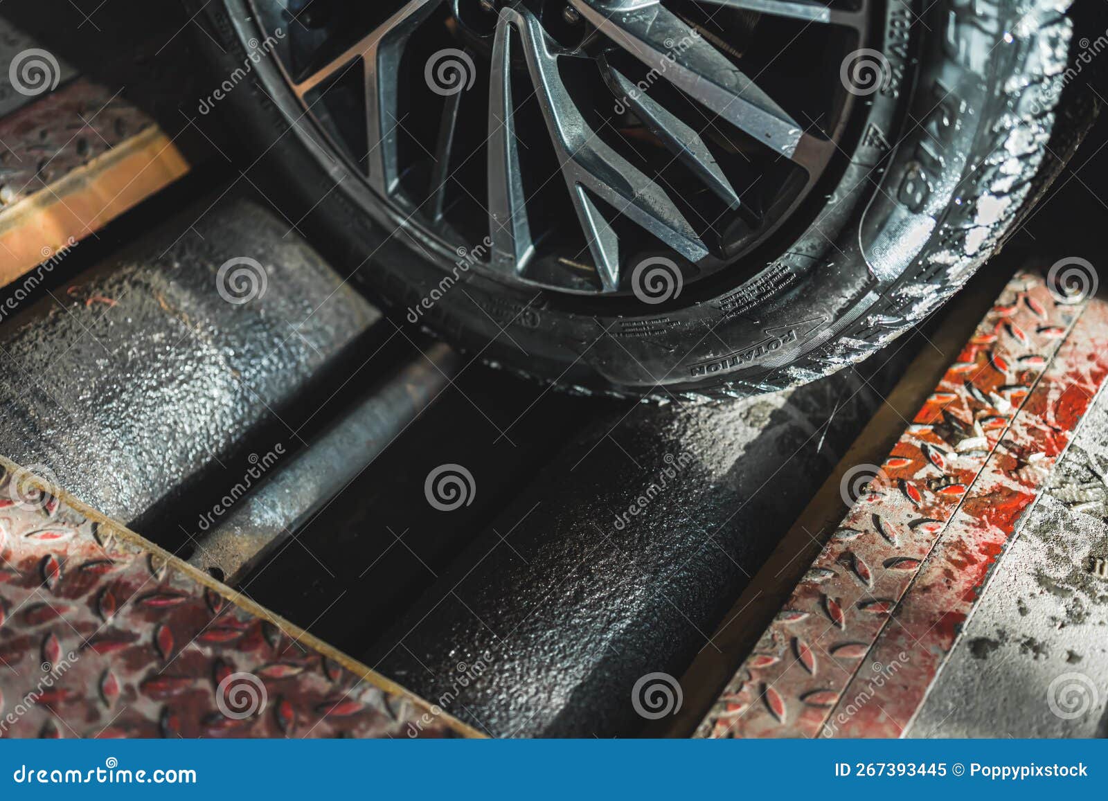 Closeup View of a Car Wheel during a Geometry Check Ensuring Proper