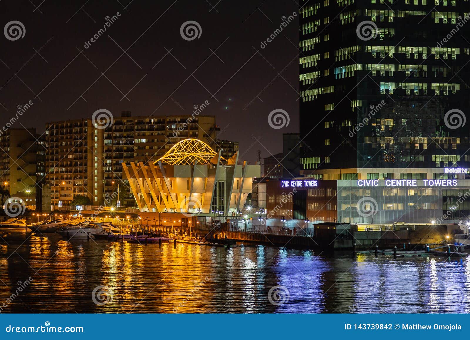 night scene of close up view of the civic center towers victoria island, lagos nigeria