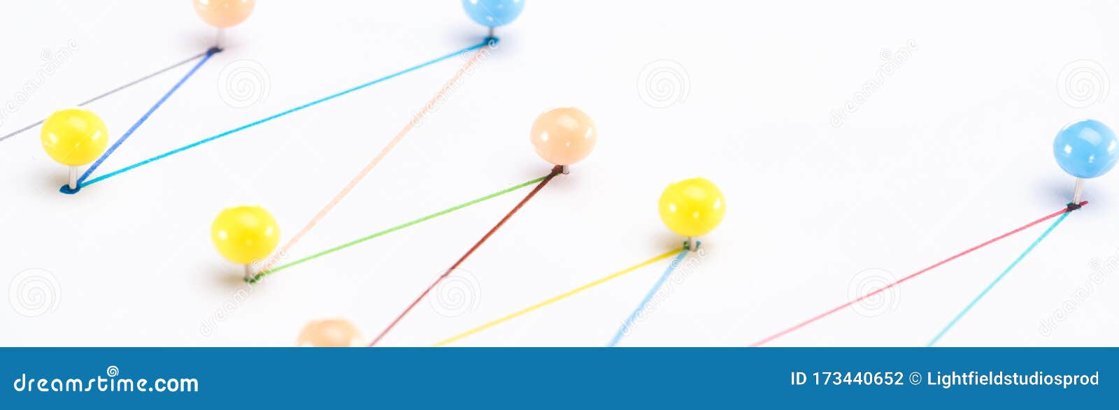 close up view of colorful connected drawn lines with pins, connection concept.