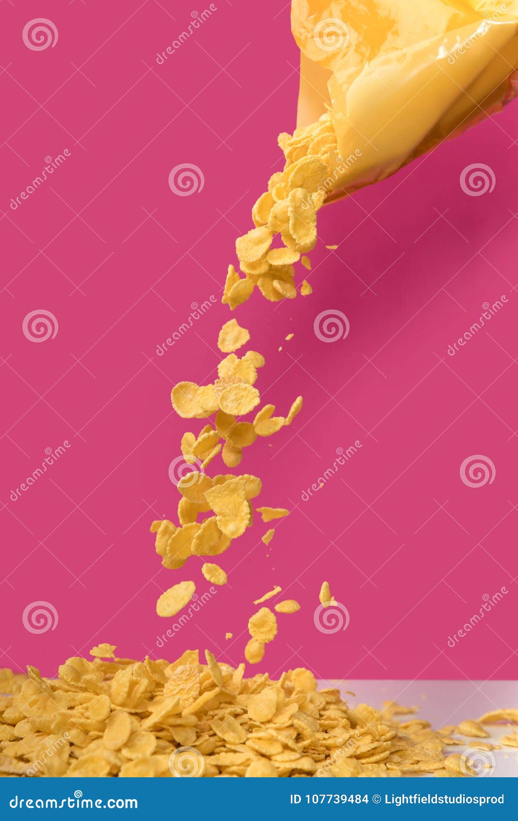 Closeup View of Corn Flakes Pouring Out from Bag Stock Photo Image