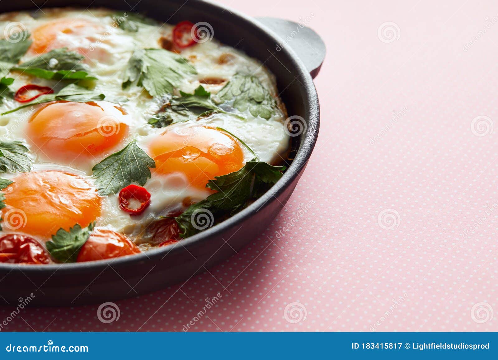 Close Up View Of Fried Eggs With Parsley Tomatoes And Chili Pepper In Frying Pan On Pink Background Stock Image Image Of People Fried 183415817
