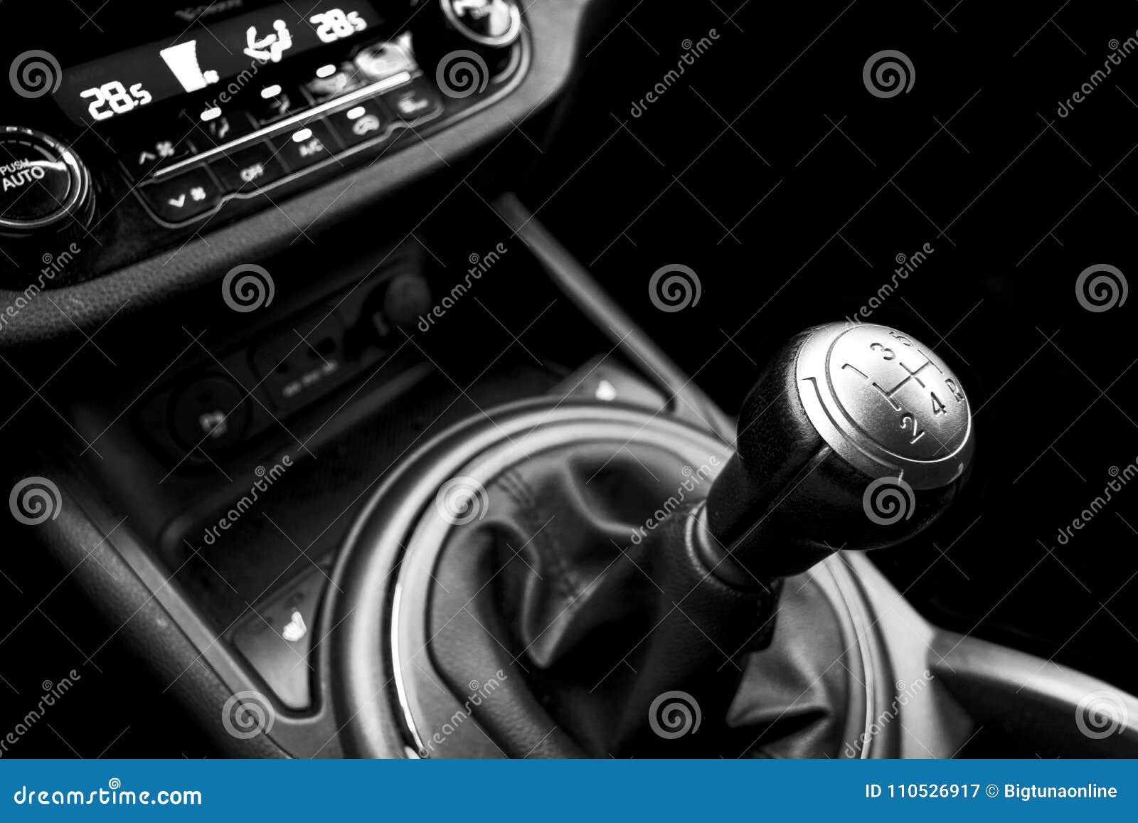 close up view of a gear lever shift. manual gearbox. car interior details. car transmission. soft lighting. abstract view. black