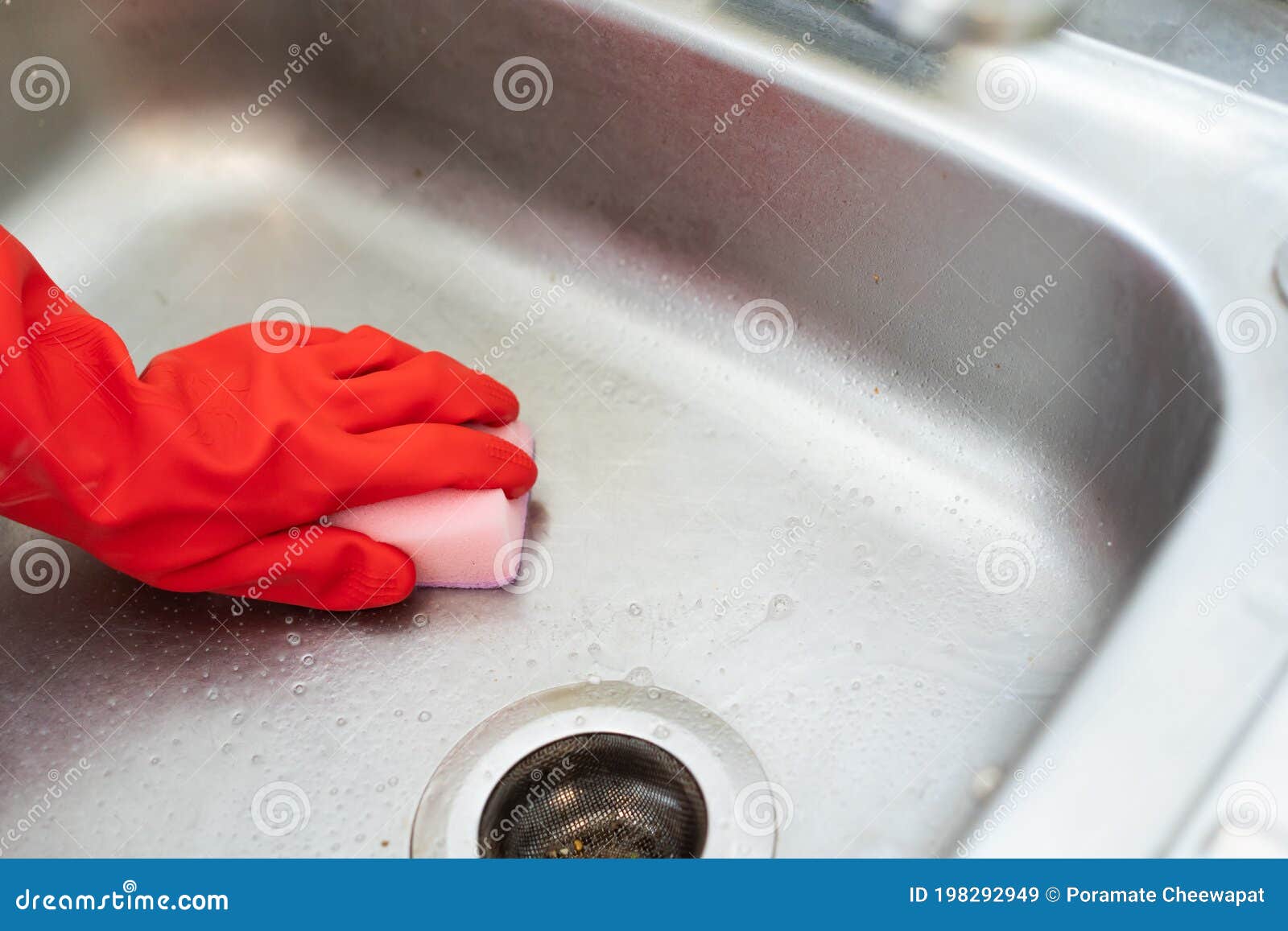Close Up View Hand in Red Cleaning Glove Using Sponge Clean the Sink in