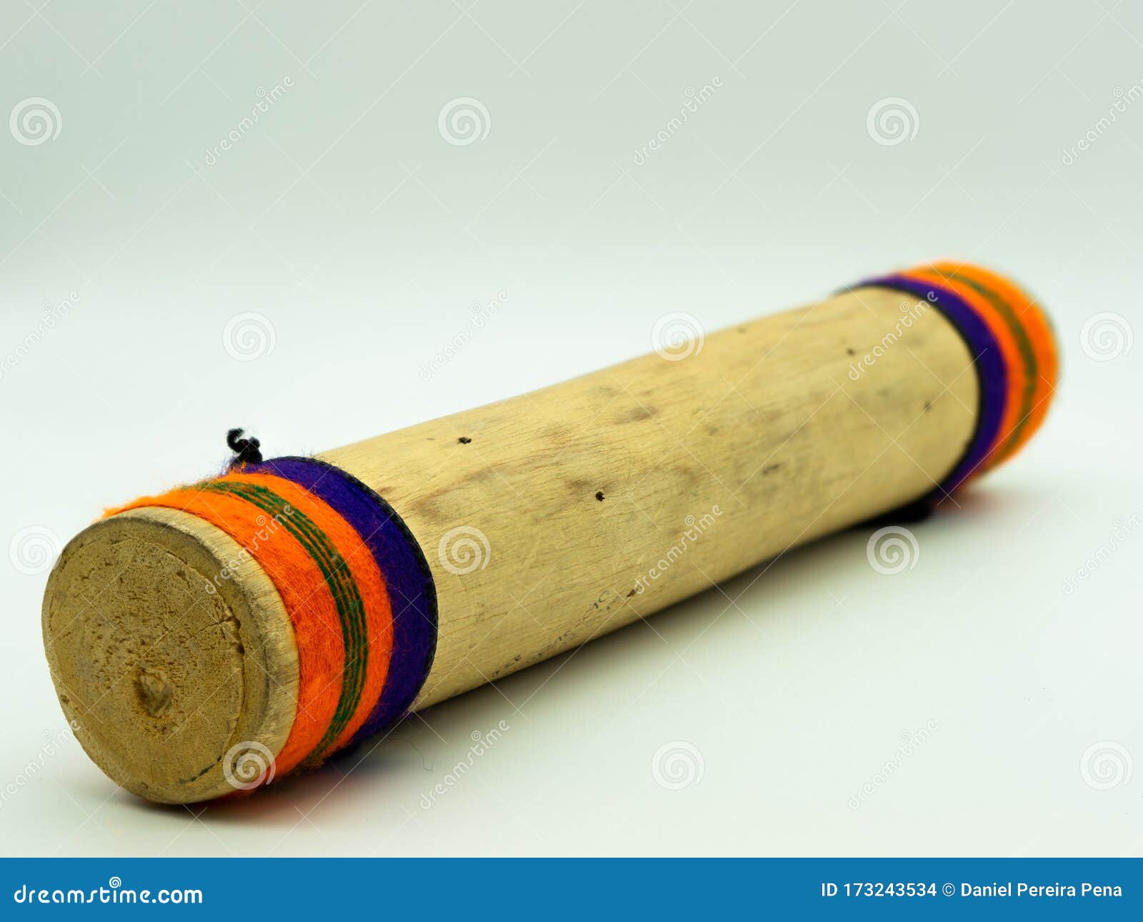 close up view of handmade wooden rain sticks on a white background. peruvian instrument. concept percussion instruments