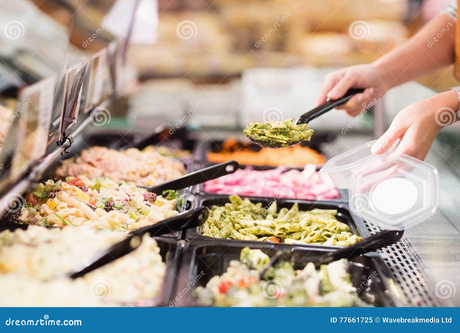 Close Up View of Hands Picking Prepared Meals Stock Image Image of