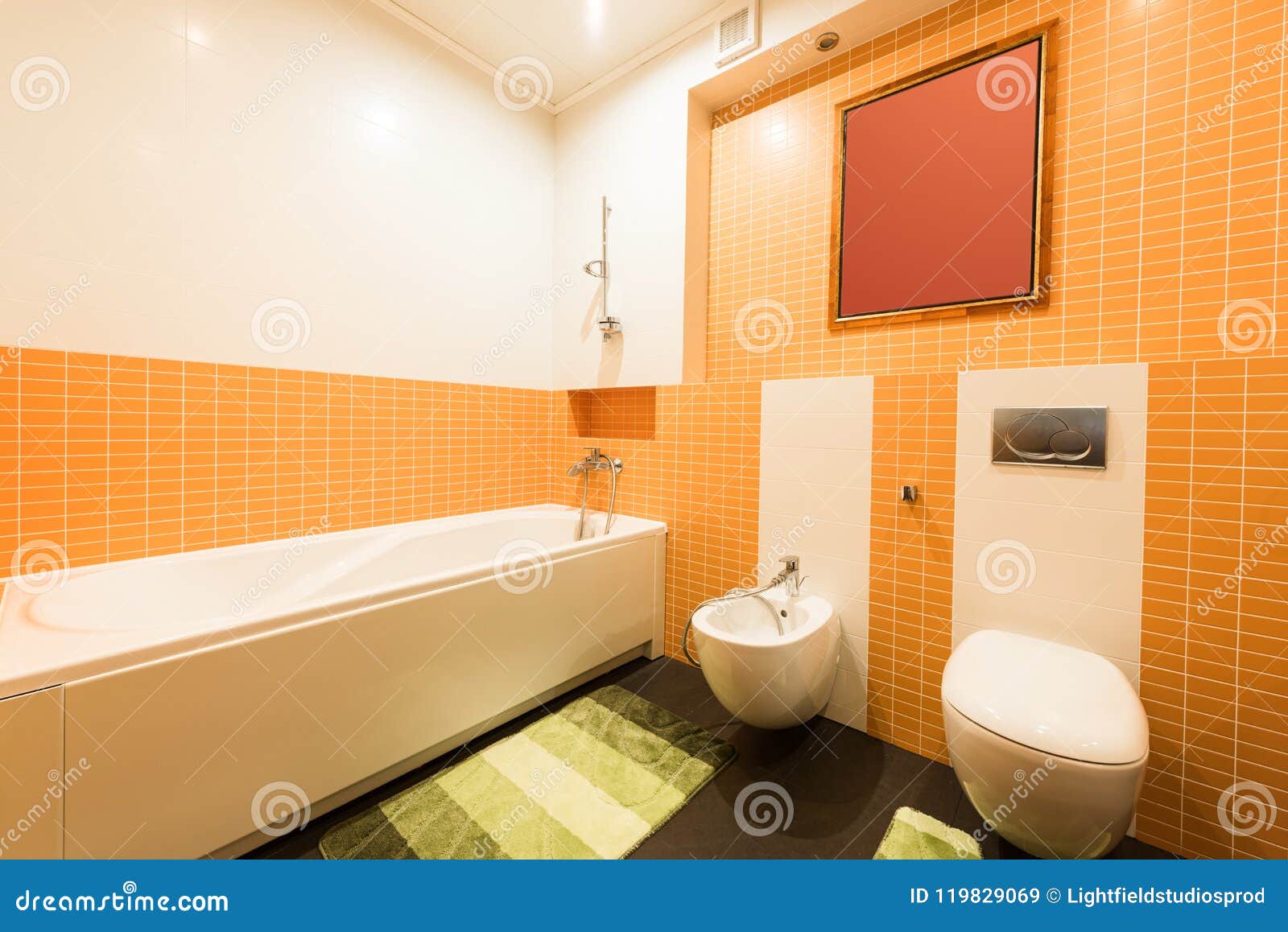 Close Up View of Modern Bathroom in Orange and White Colors Stock Image