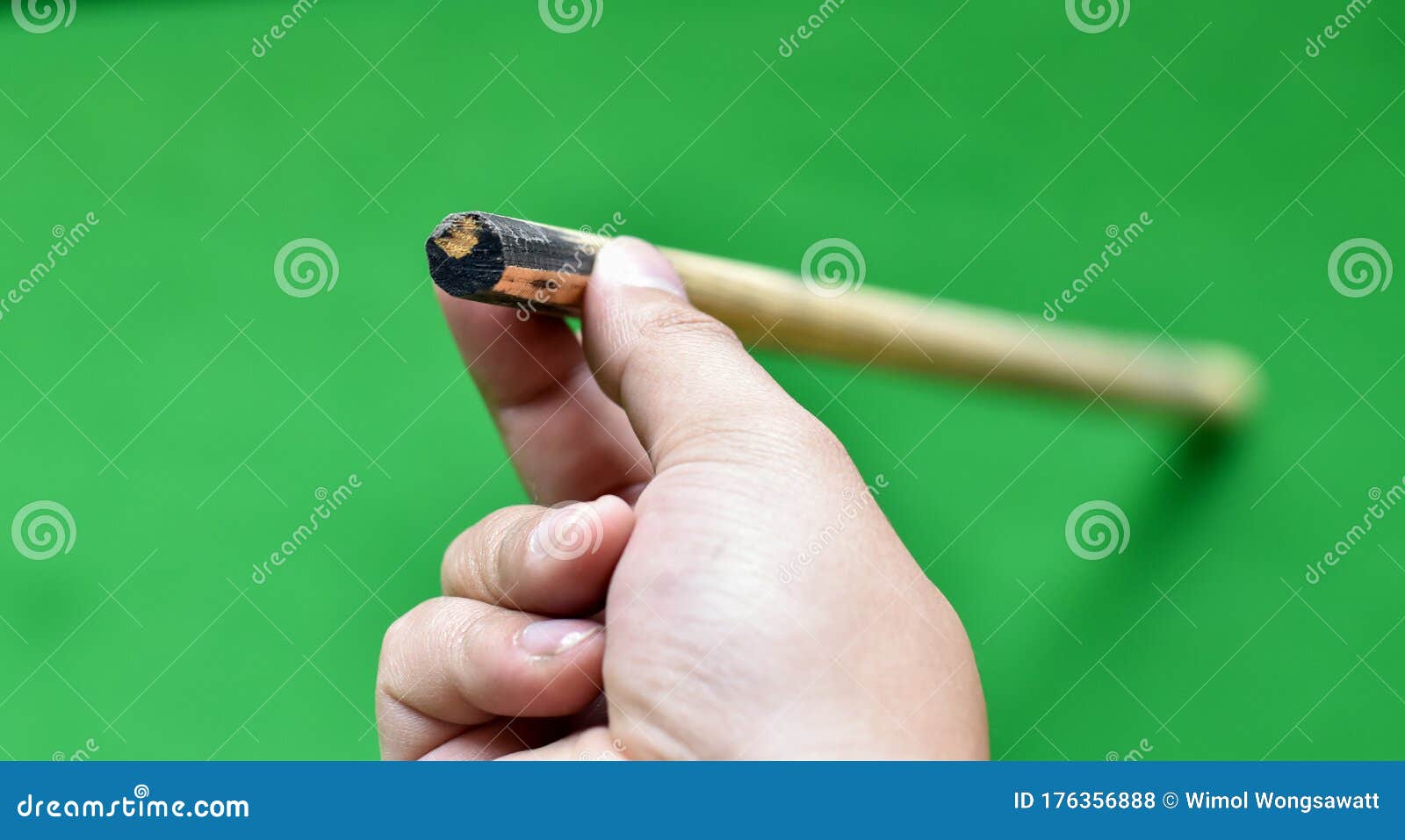 Closeup View, Snooker Cue Stick in Holding Hand. Stock Photo Image