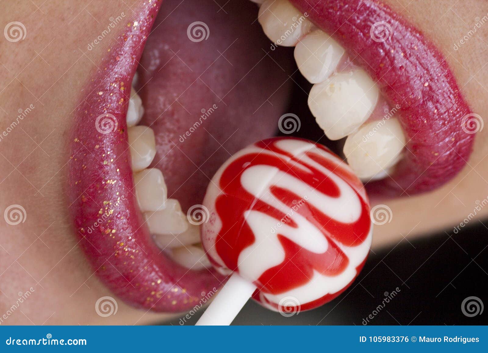 Red lips with lollipop stock photo. Image of colorful 105983376