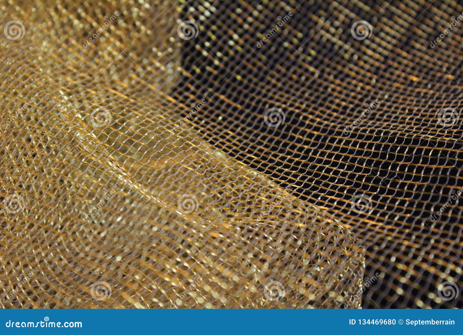Gold colored mesh fabric stock photo. Image of colored 134469680