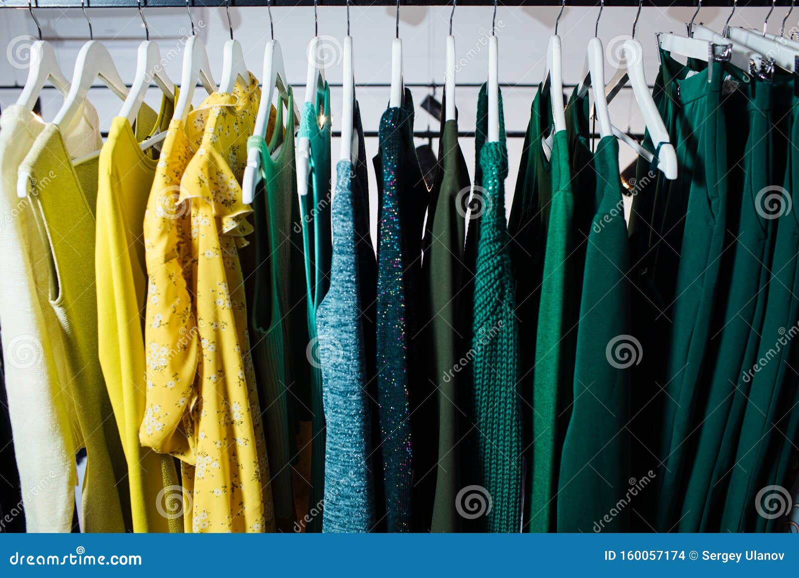 Close-up View of Various Stylish Clothes Hanging on Hangers in Boutique ...