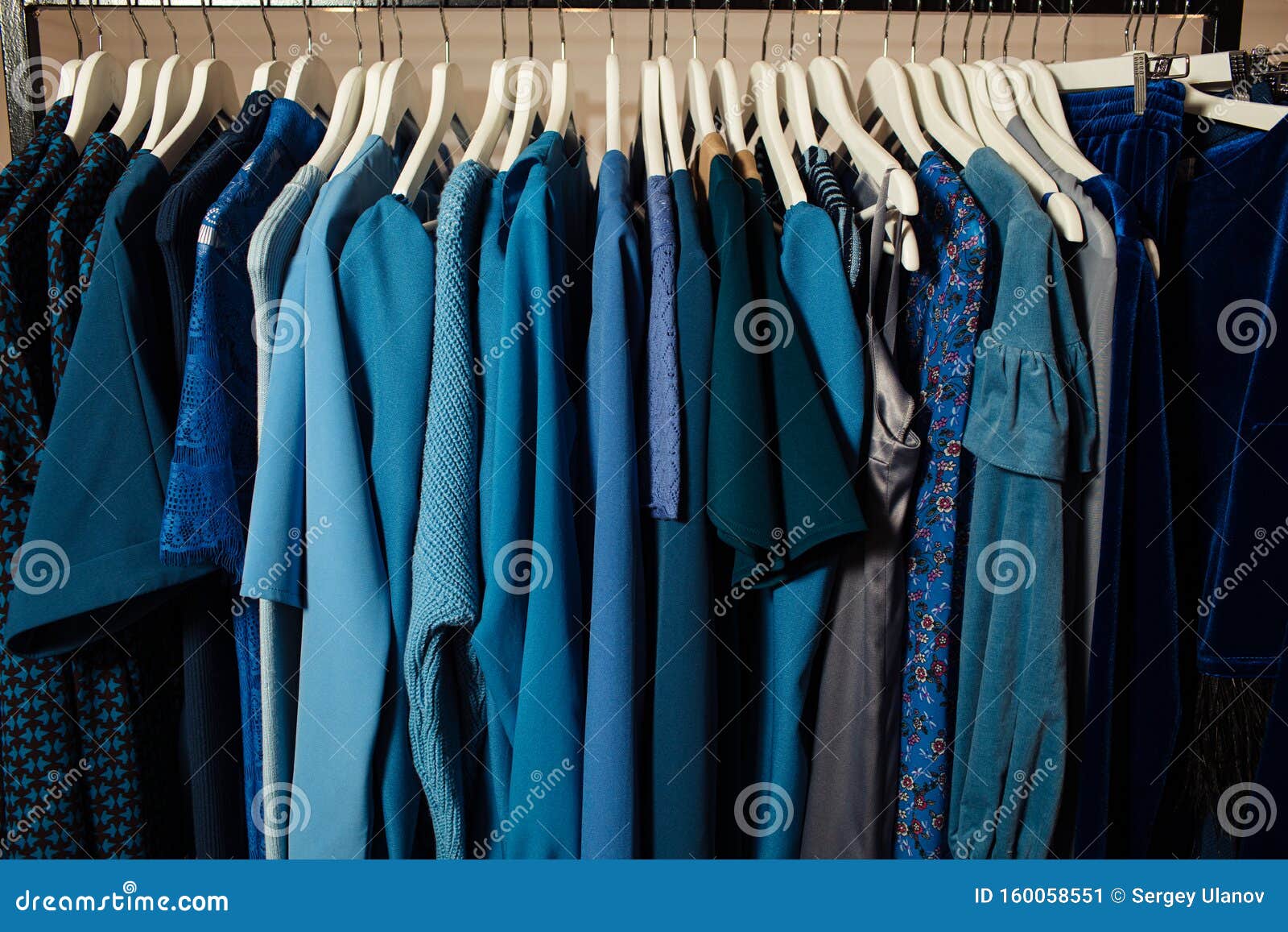 Close-up View of Various Stylish Clothes Hanging on Hangers in Boutique ...