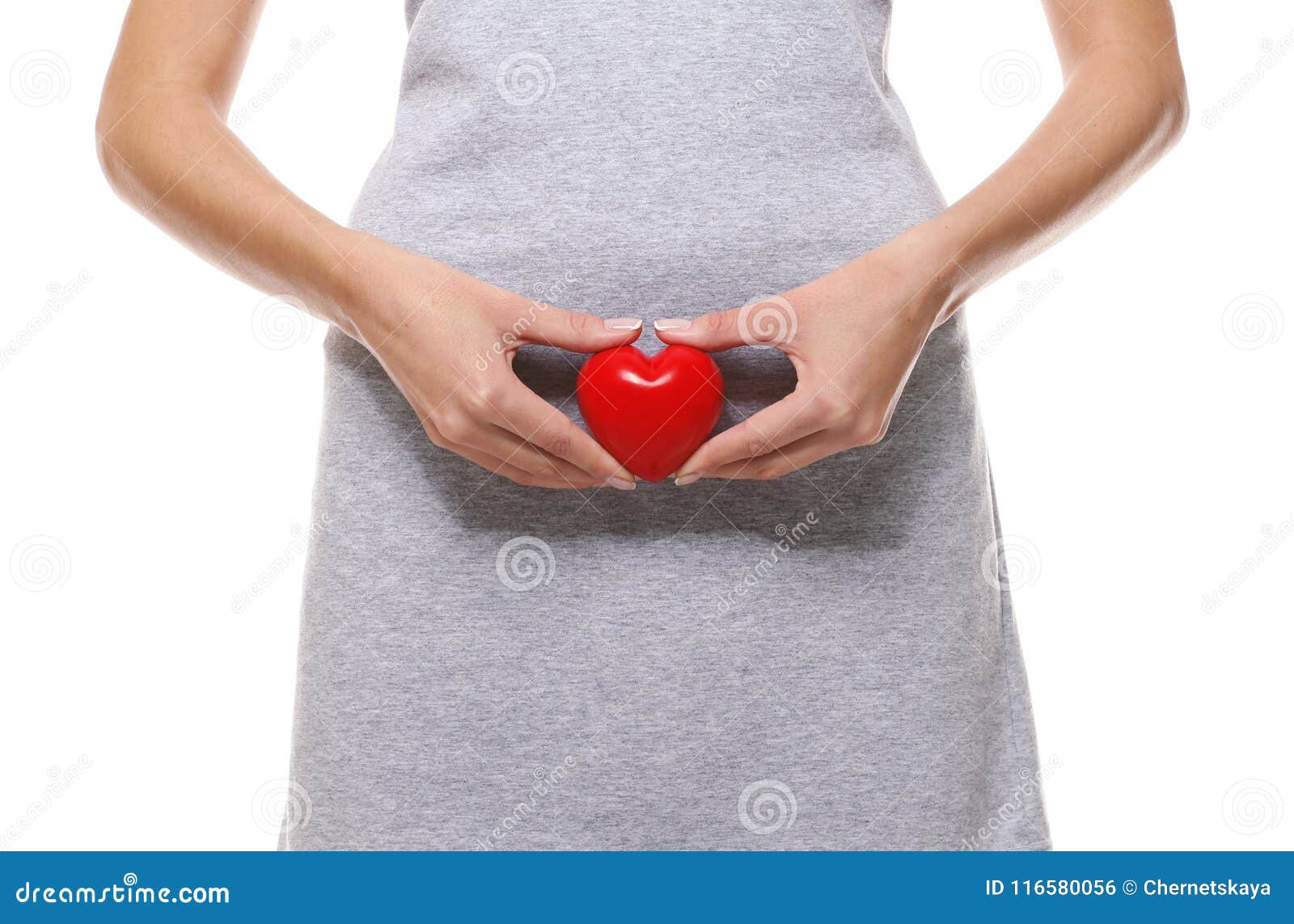 close up view of woman with red heart on white background. gynecology concept