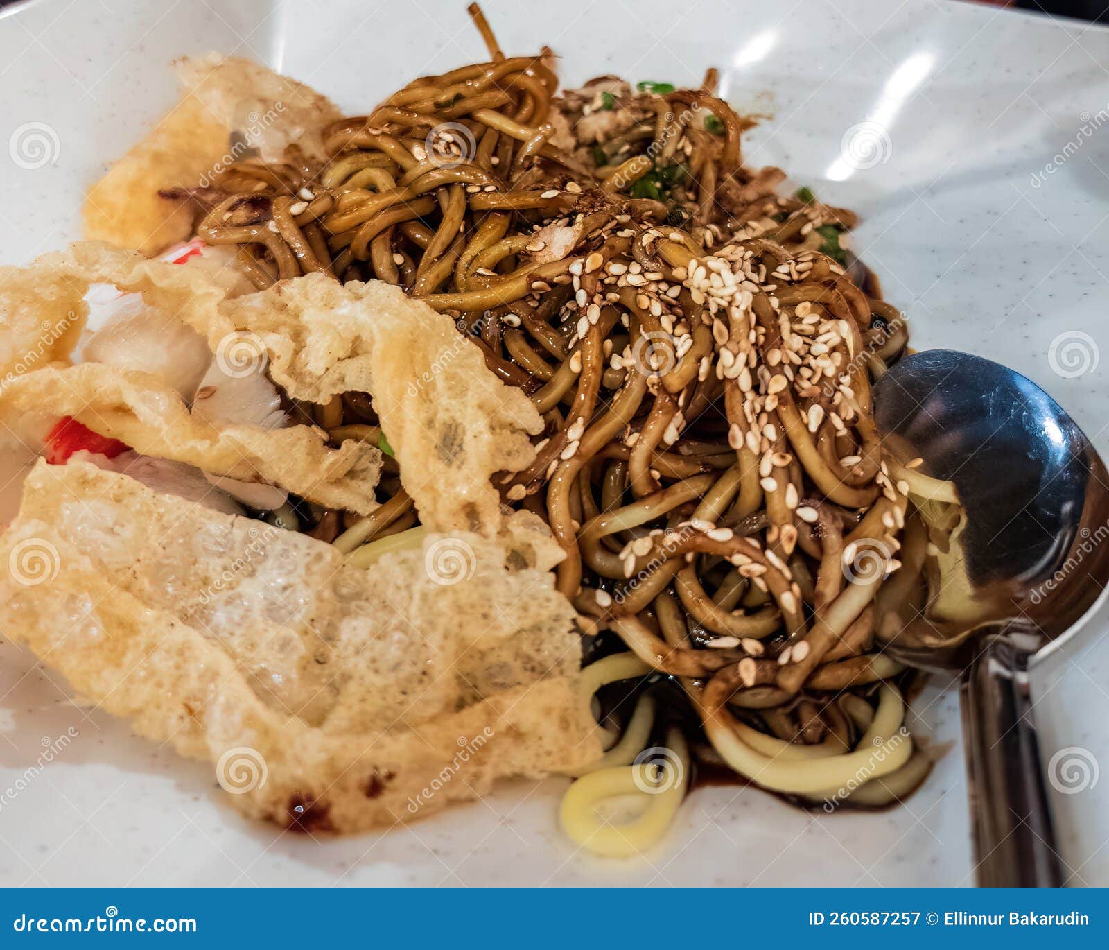 Close Up of the Wantan Noodle with Fried Bean Curd and Sesame Stock
