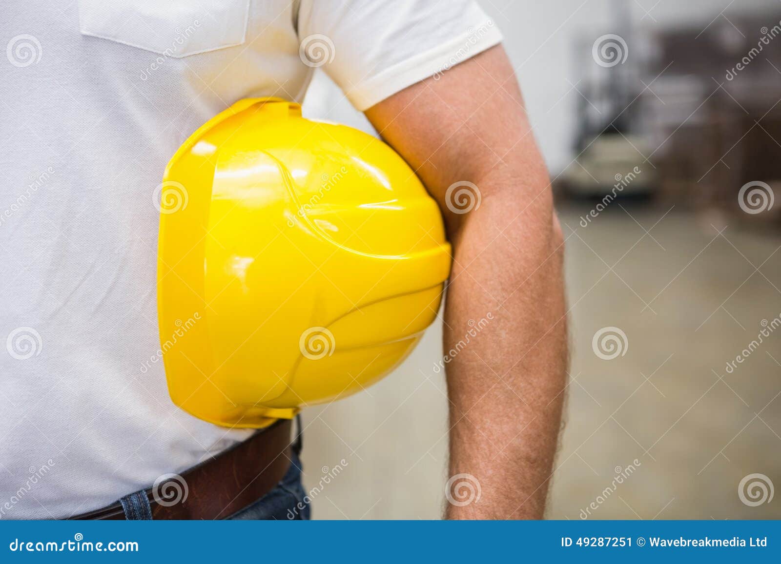 Close Up of Warehouse Worker Holding a Hard Hat Stock Image Image of