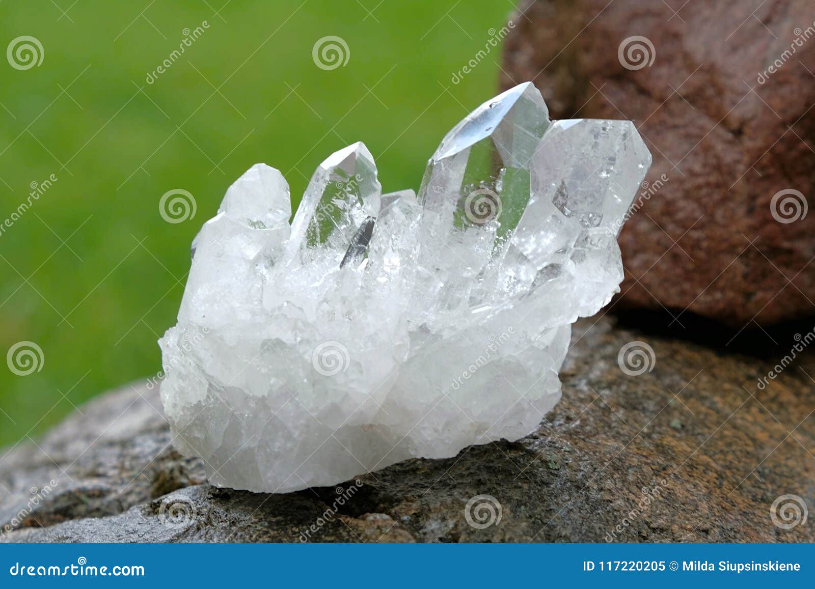 quartz crystal cluster on a rock