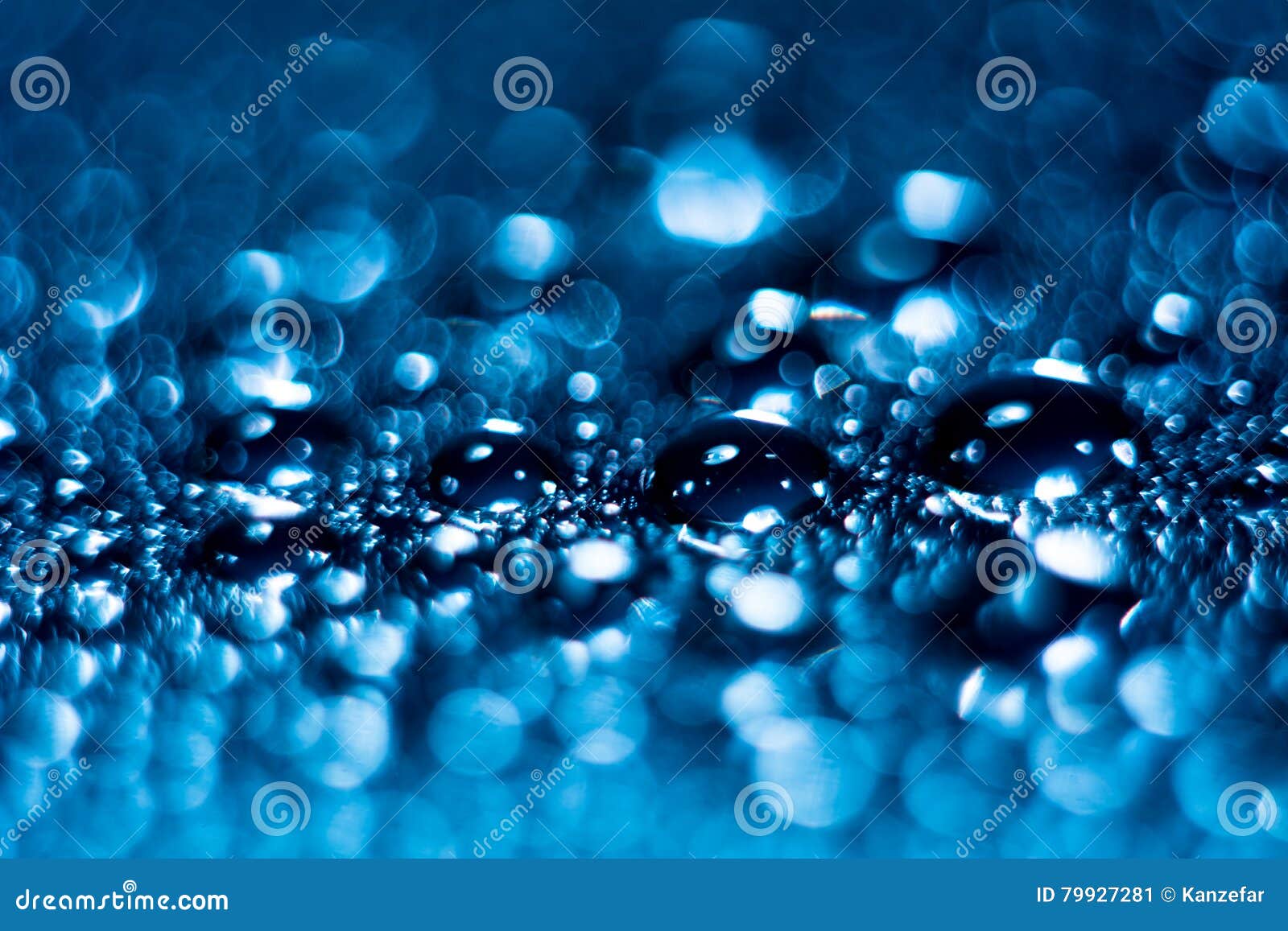 close-up of water droplets on reflective surface