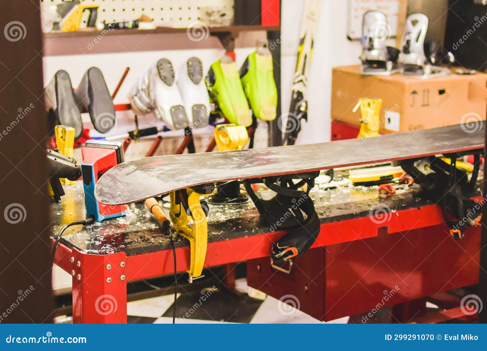 Close Up Waxed Snowboard on Repair Table. Messy and