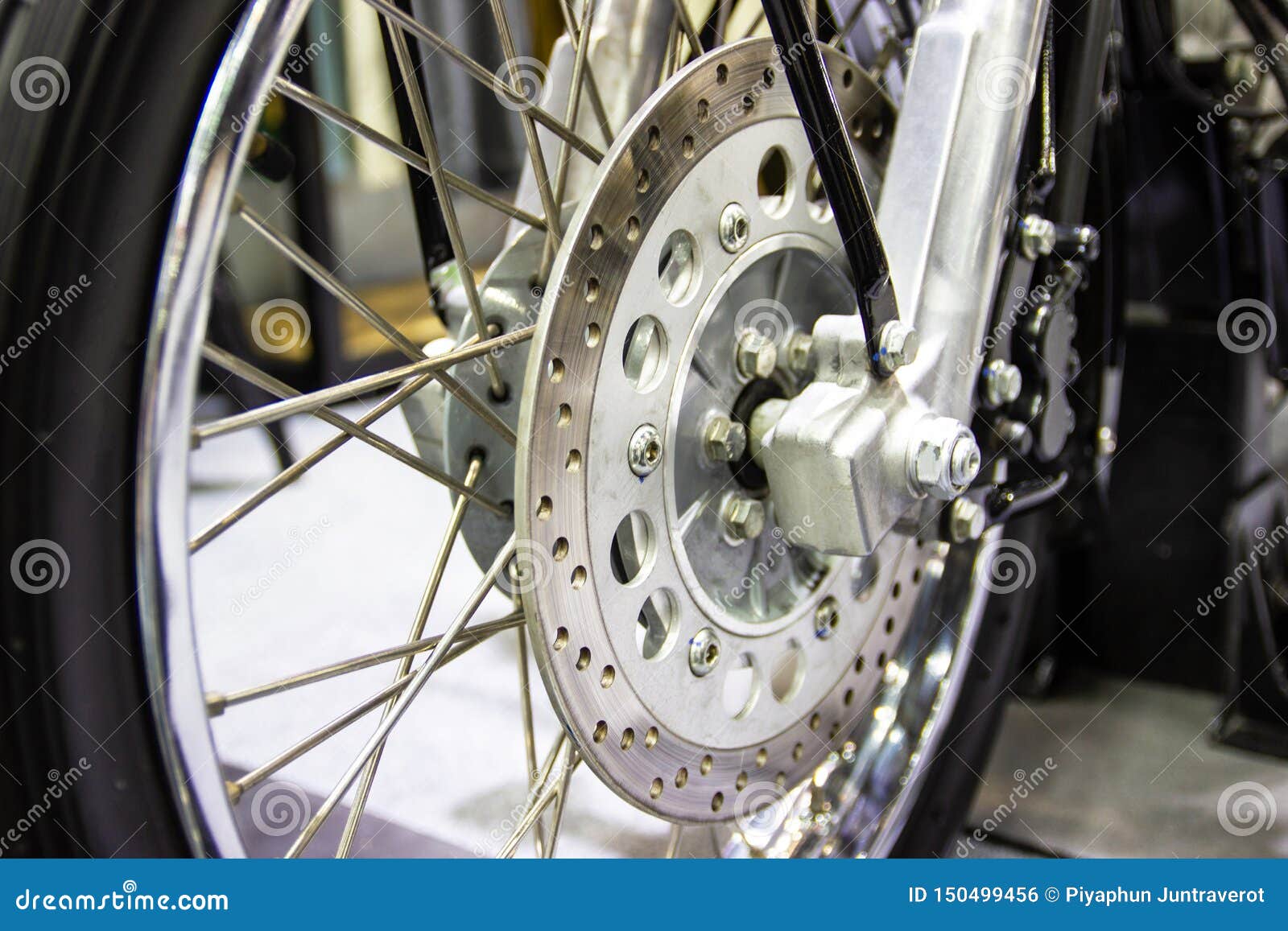 Close Up Wheel Spokes and Brake Disc of a Motorcycle Stock Photo