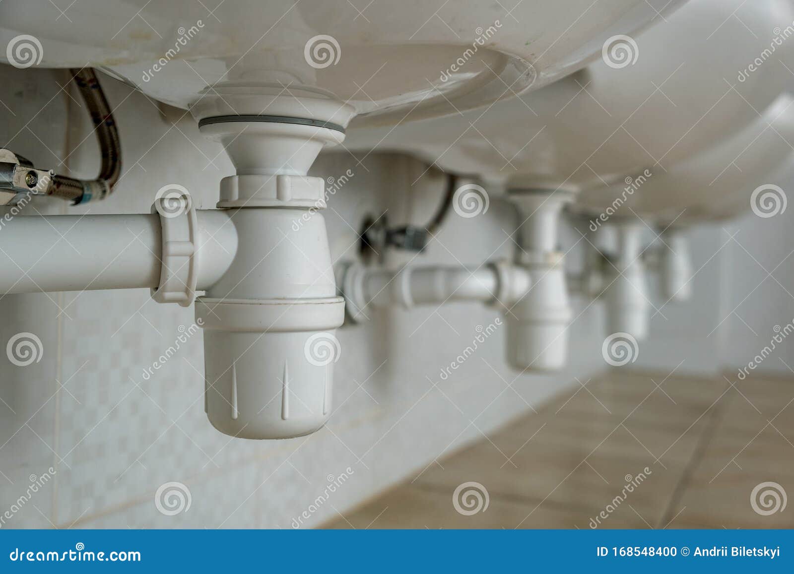 Close Up Of White Plastic Pipe Drain Under Washing Sink In Bathroom Stock Photo Image Of Fittings