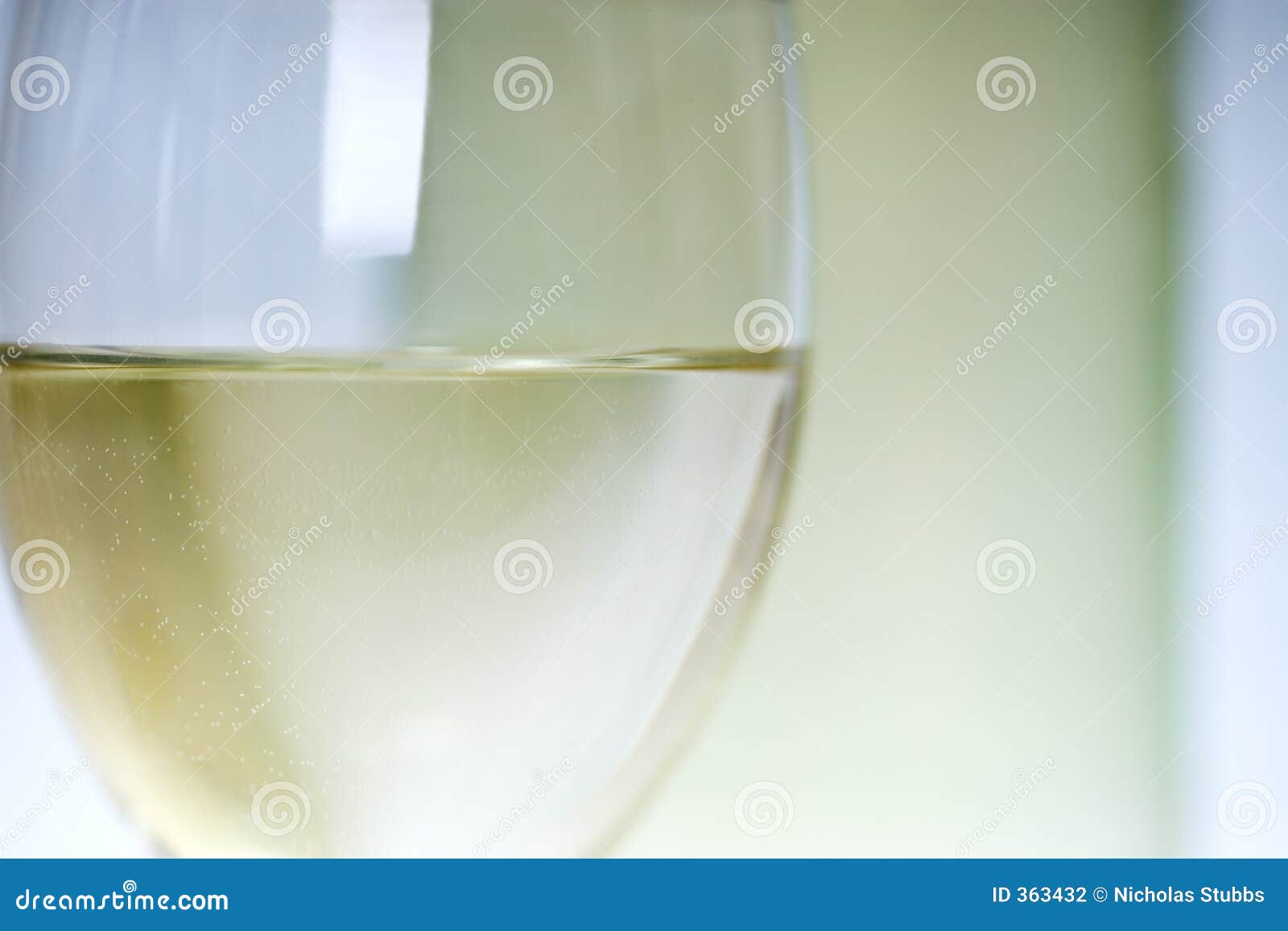 close up of white wine in glass