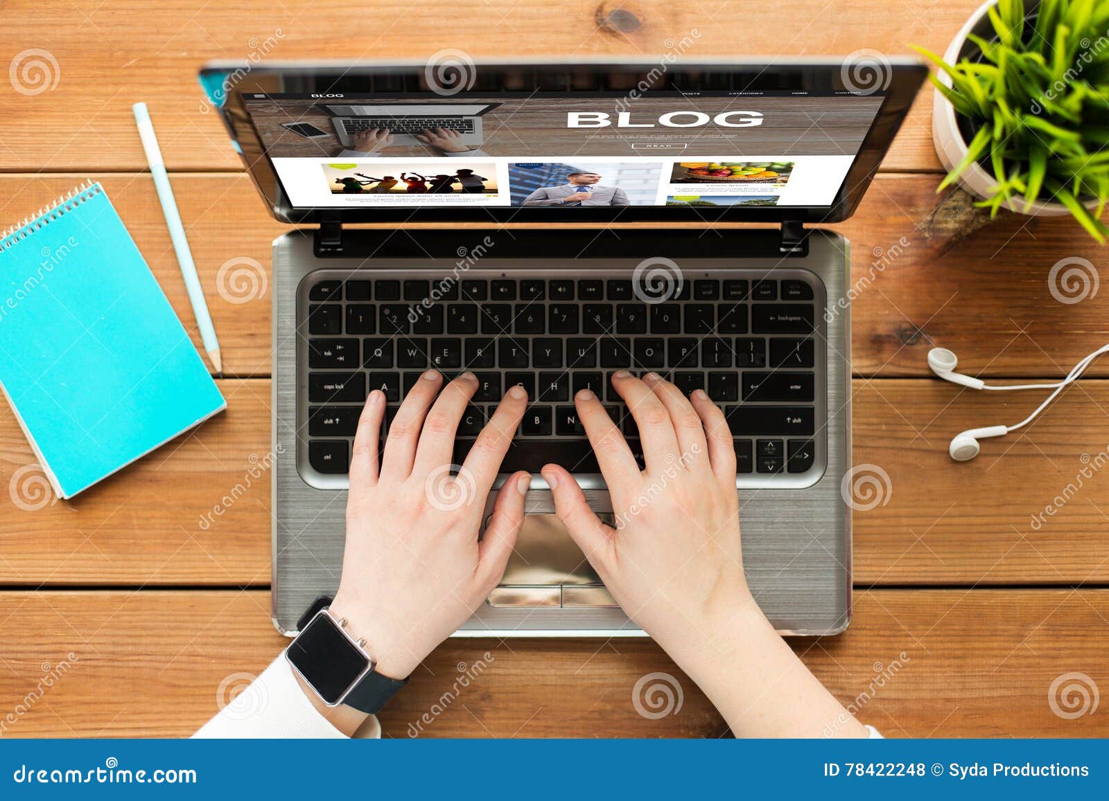 close up of woman blogging on laptop