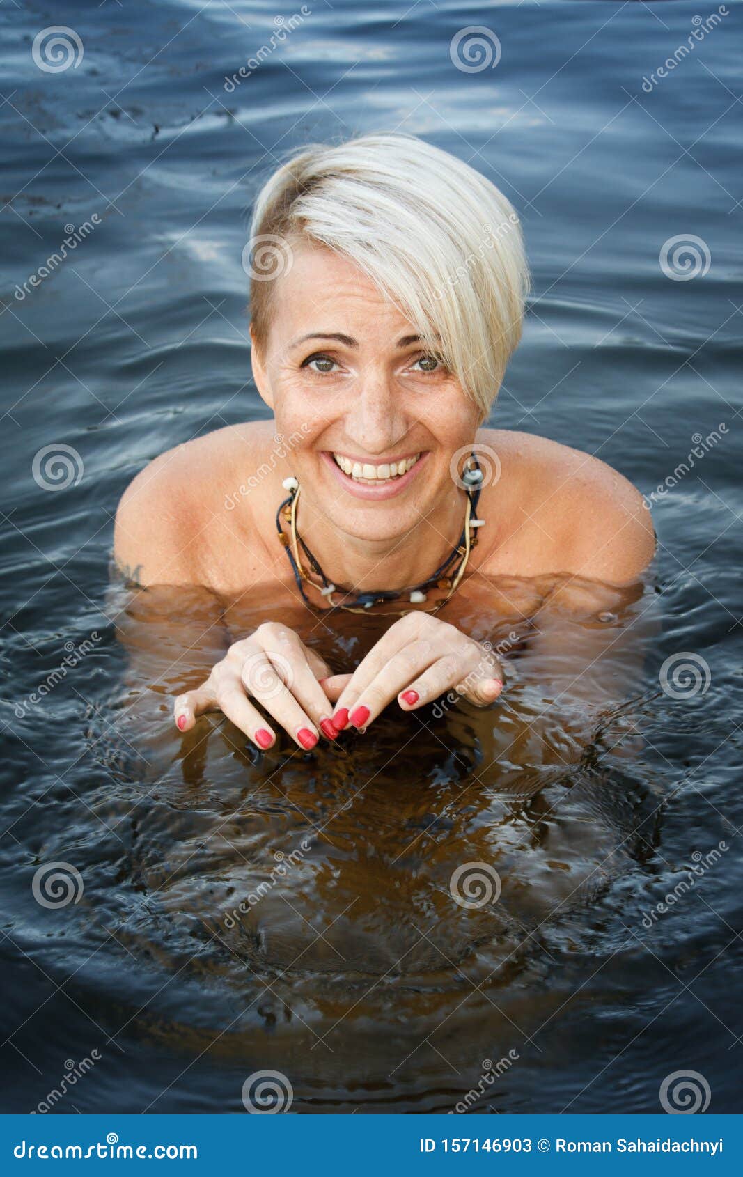 1067px x 1689px - Close-up of a Woman Blonde Middle-aged Nude Swims in the River, Selective  Focus Stock Image - Image of harmony, natural: 157146903
