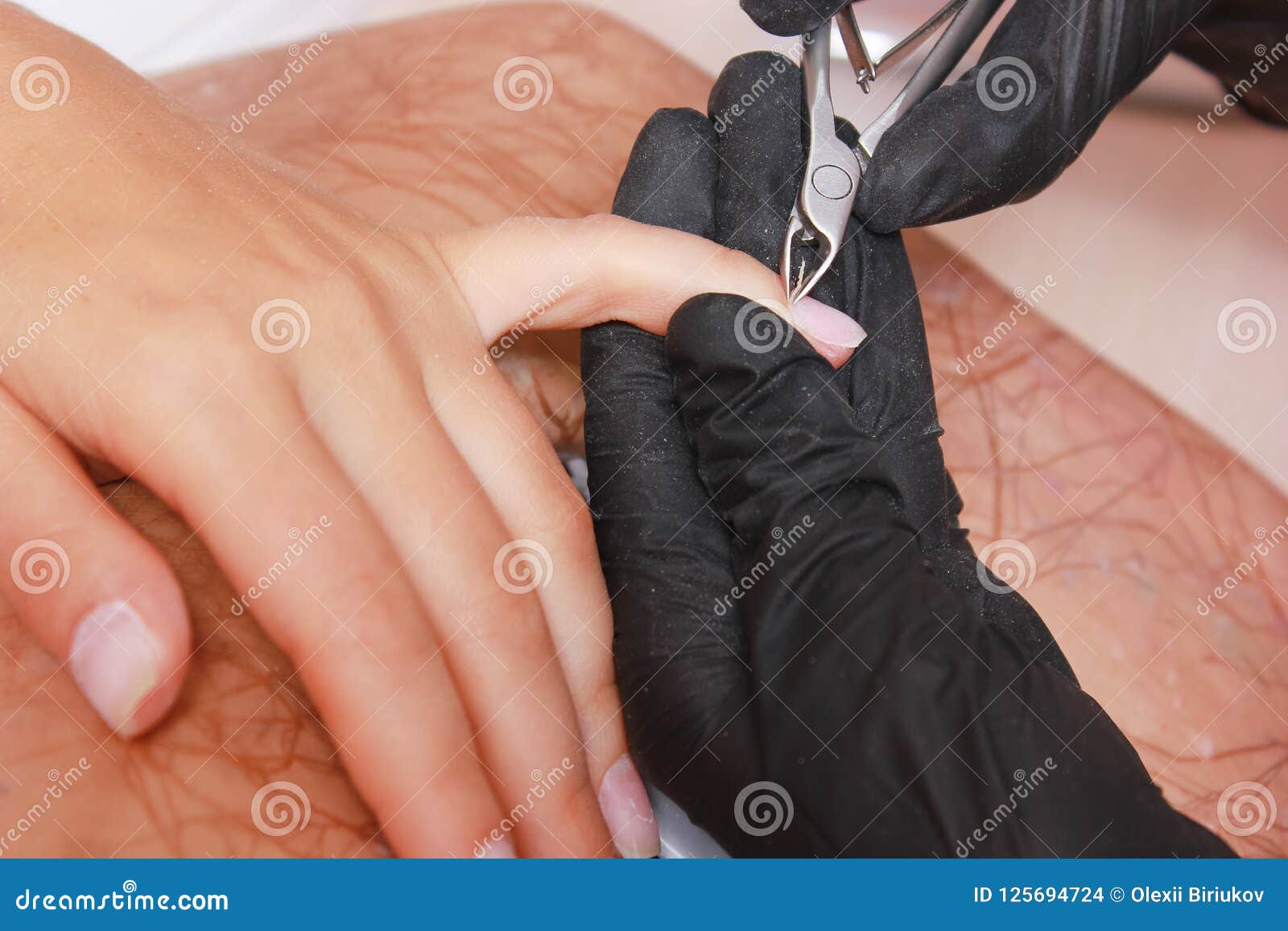 Close Up Woman Hand while Process of Manicure in Nail Shop. Beautiful ...