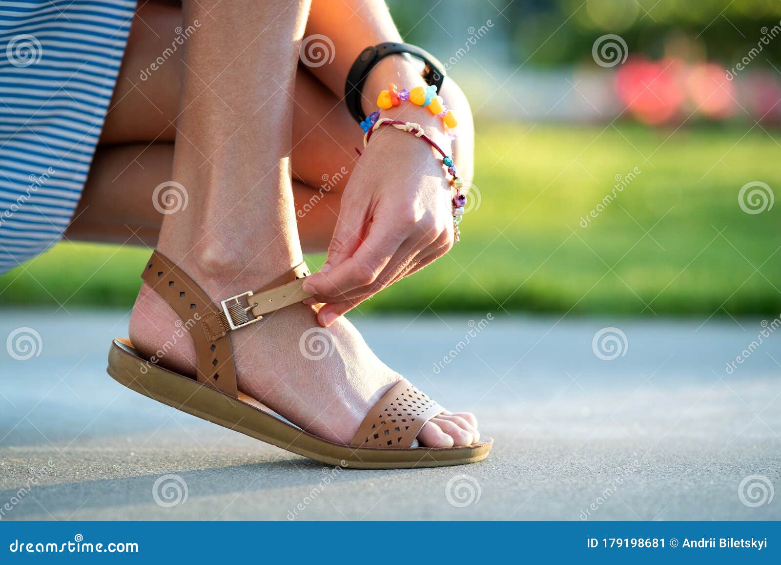 Close Up of Woman Hands Tying Her Open Summer Sandals Shoes on Sidewalk ...