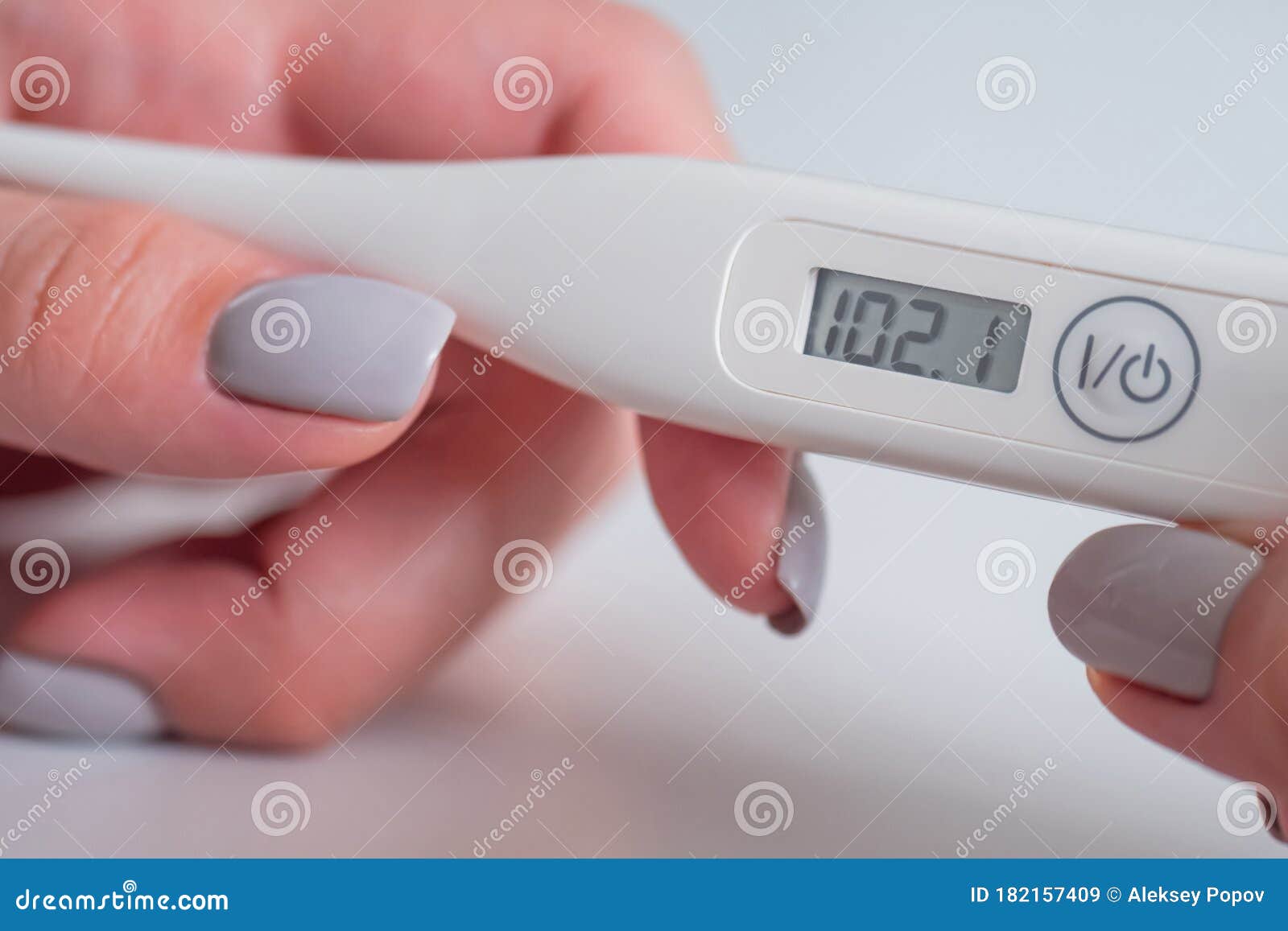 https://thumbs.dreamstime.com/z/close-up-woman-holding-digital-medical-thermometer-high-temperature-hands-white-selective-focus-healthcare-measurement-182157409.jpg
