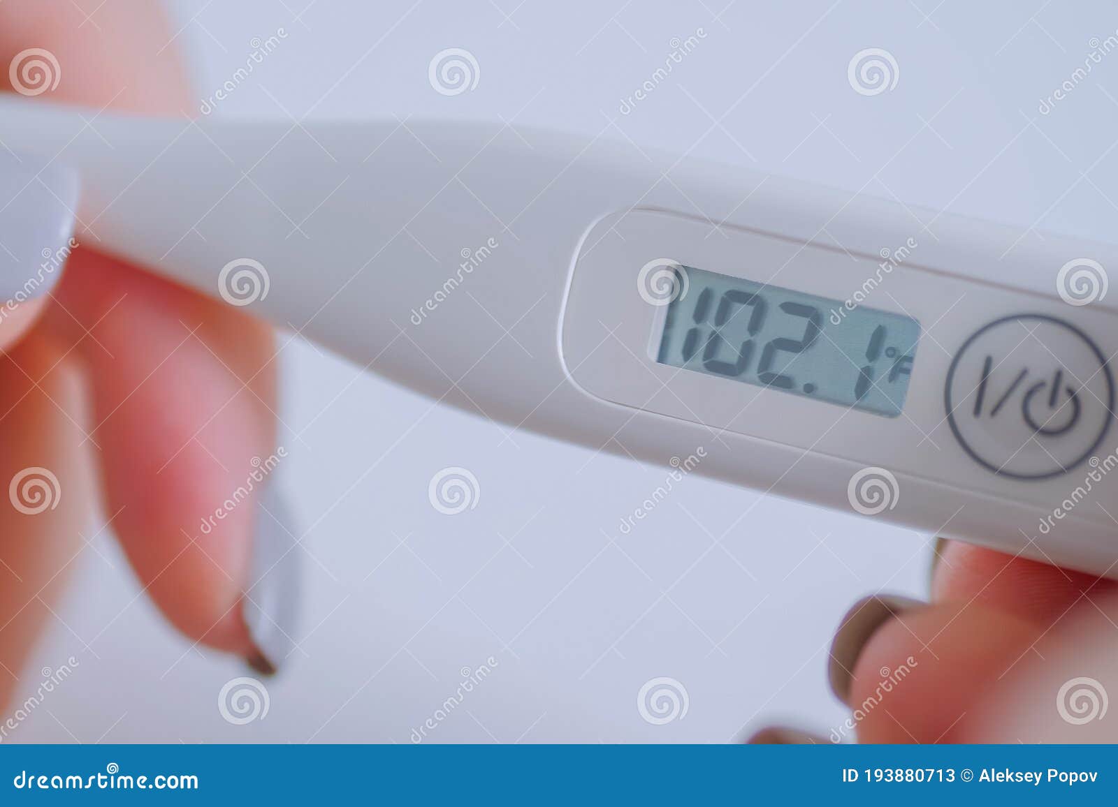 https://thumbs.dreamstime.com/z/close-up-woman-holding-digital-medical-thermometer-high-temperature-hands-white-table-selective-focus-healthcare-193880713.jpg