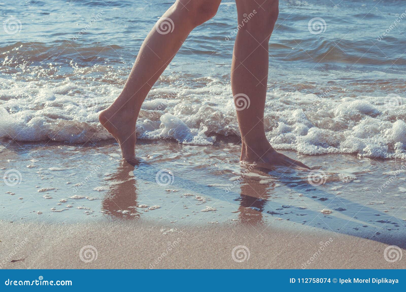 Woman Walking Barefoot On Ocean Beach Stock Image - Image 